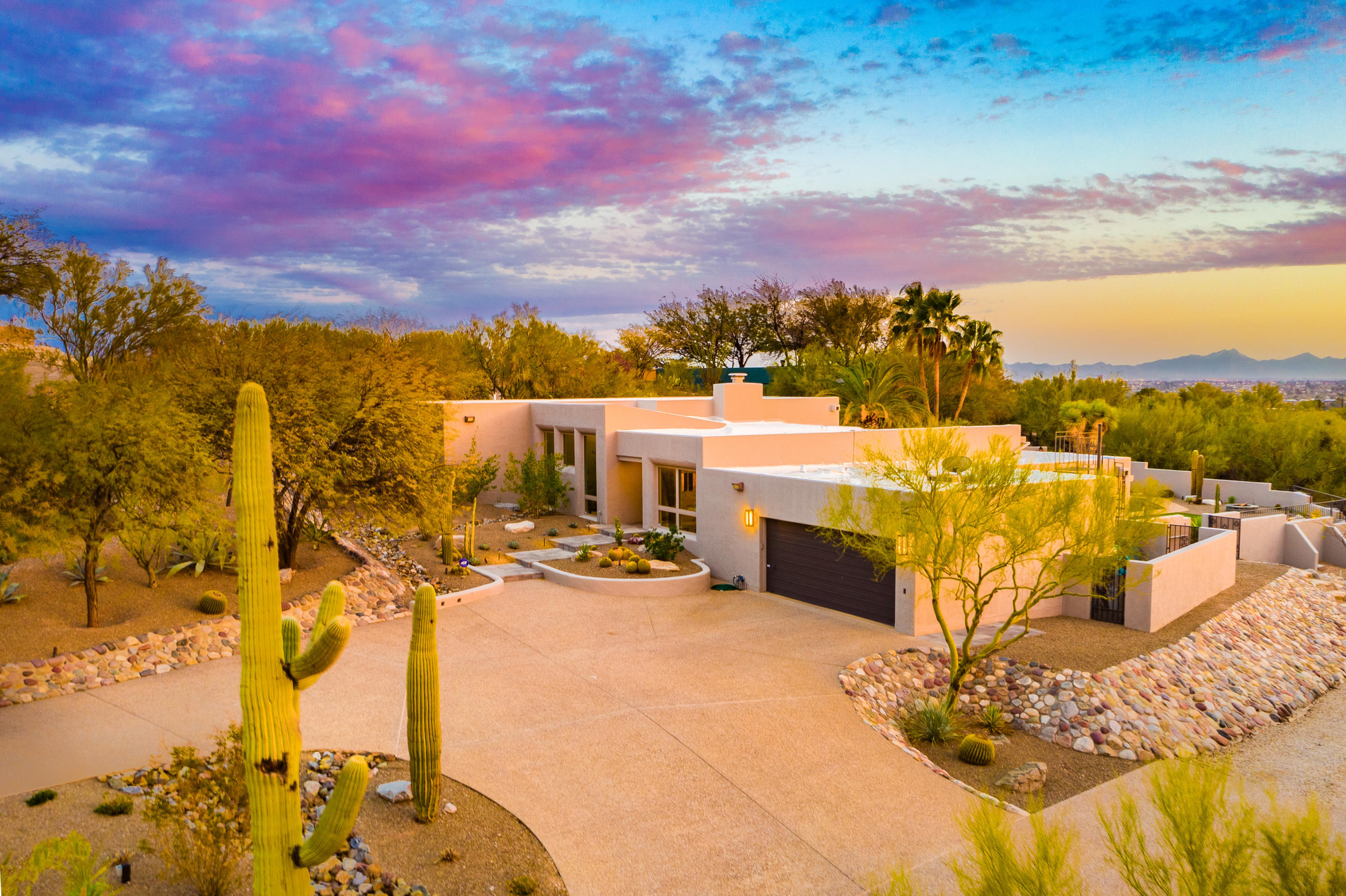 Turn Key trophy property in the foothills ready to move into!!  Enjoy the completely private back yard with Pebble Tec Pool & separate Spa. Unobstructed beautiful mountain views for days and  views of the city lights at night. Entertain & relax on your expansive patio or by the Fire Pit. The Chef's kitchen with Sub-Zero refrig, 
& Granite  counters opens to Great Room with vaulted ceilings, exposed beams & a dramatic floor-to-ceiling stacked slate fireplace. A spacious formal dining room  with picture window framing Catalina Mountains views and a fully lighted Desert landscape. Relax in a second Great Room with equally beautiful views!