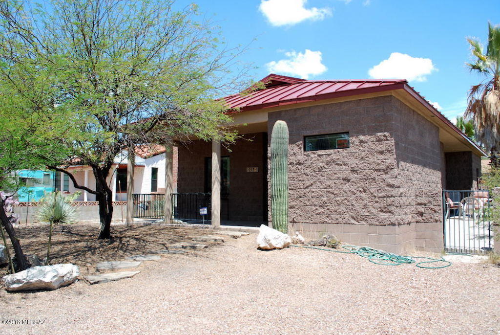 Pre-Leasing for August 2019. Please DO NOT DISTURB TENANTS. Contemporary Block Construction 3 Bed 2 Bath Home in Foster Addition just off the Mountain Ave Bike Path and North of Grant.1.5 Miles to University of Arizona. Built in 2003 with Metal Roof, dual pane windows, polished concrete floors. Open kitchen and living area with multiple access points to side patio and high vaulted ceilings. Kitchen has maple cabinets, tile backsplash, and breakfast bar. Huge Laundry Room could double as some indoor and bicycle storage. Side and front patio, Central A/C & Heat. This home is offered as NON-SMOKING. Dogs up to 75 lbs in size with a maximum of 2 will be considered. Owner will NOT allow cats.