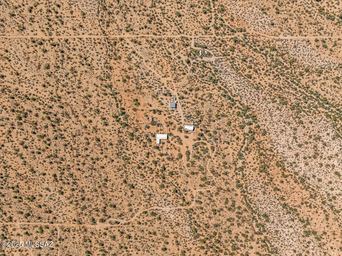Escape the hustle and bustle and discover wide-open possibilities on this beautiful 30-acre property in Marana. Perfectly situated to capture stunning mountain views and endless desert skies, this unique parcel offers both peaceful seclusion and practical potential. The property includes a cozy single-wide mobile home, ideal as a full-time residence, weekend retreat, or temporary living space while you build your dream home. With level terrain, mature desert vegetation, and ample room for expansion, the land is perfectly suited for horses, agriculture, or future development. Enjoy the quiet rural lifestyle with room to roam, yet still be within reasonable distance of Marana's amenities, major highways, and shopping.