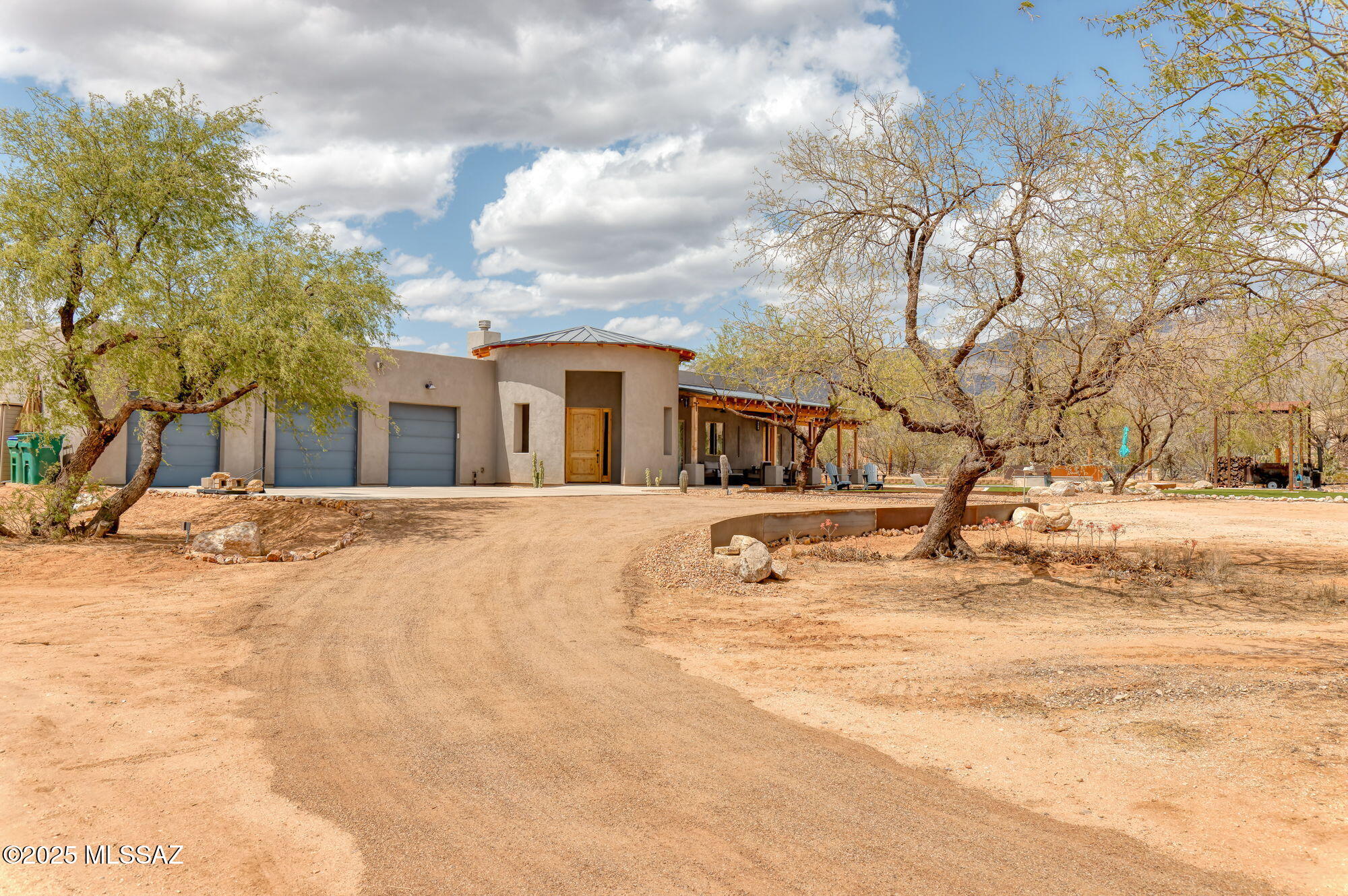 Combining the best of the Tanque Verde Valley! Custom 2022 4 bed, 3 bath, 2,954 sf home has it all. 2.5 acres of private land, w/ no HOA, allows space for every need. The Modern Ranch Exterior blends seamlessly w/the interior of the home. Large interior gathering areas overlook the expansive patios, yard, & pool/spa all while having the backdrop of both the Catalina & Rincon Mountains. Split bedroom plan w/ Large Primary Suite including tranquil Tadelakt Plaster shower. 3 add'l bedrooms, mud room, flex room make up remainder of space. Oversized 3 car garage, RV Hook ups, abundance of space for all vehicles & toys to be kept orderly/out of sight. Still need space? How about the vintage hobby hut, equipped w/ both water & electric. Just a short jaunt to TV Schools & Nature destinations.