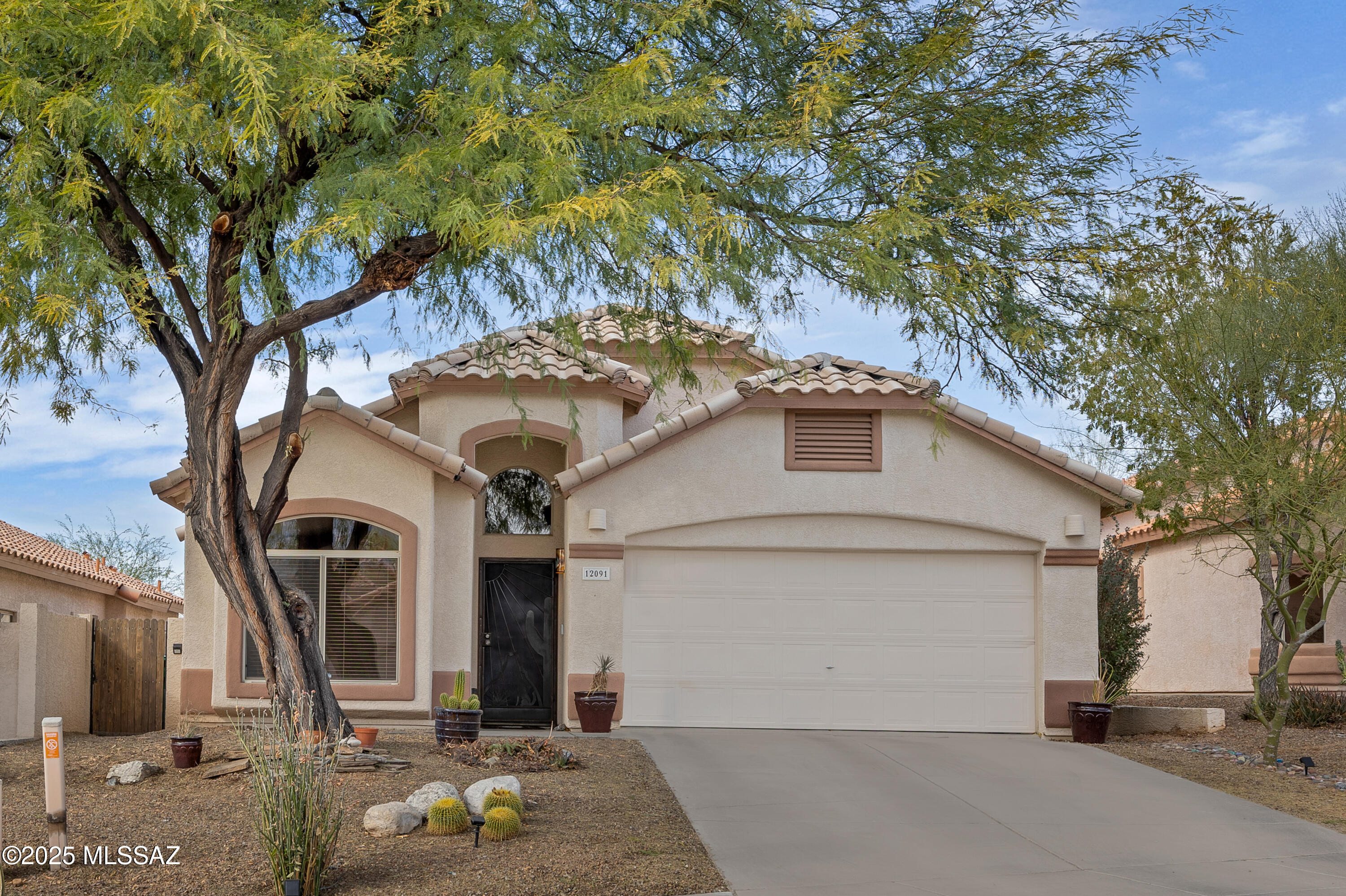 This beautiful single-story home offers 4 bedrooms, 2 baths, and 1,812 sq ft of upgraded living space. Enjoy the views of the Catalina Mountains and modern touches throughout the home, including granite countertops, sleek cabinetry, tile flooring, and a spacious laundry room. Step outside to your private oasis featuring a sparkling pool, perfect for cooling off during Arizona's hot summers. Located in the desirable Overlook at Rancho Vistoso, this home is close to parks, trails, shopping, and top-rated schools. Don't miss your chance to own this move-in-ready gem! Schedule a tour today! Both owners are licensed to sell real estate in the State of Arizona.
