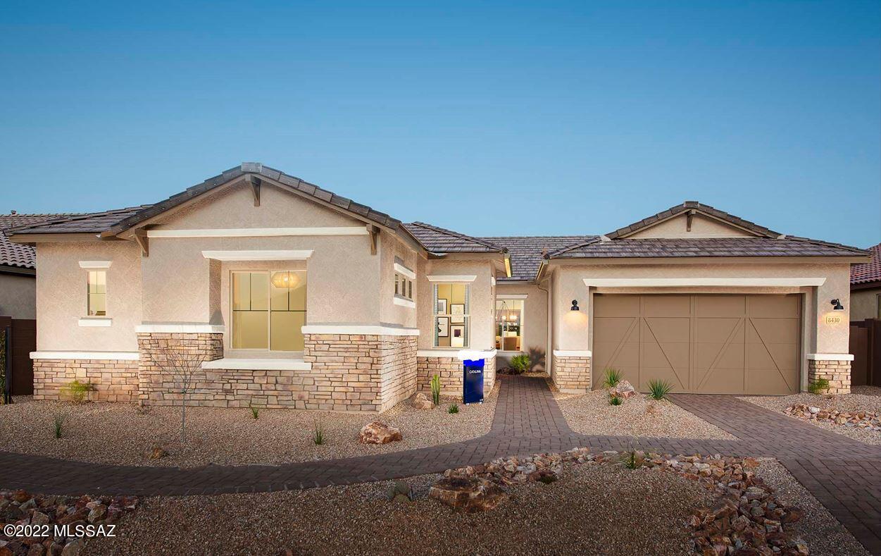 This beautiful Catalina former model home design features over $200,000 of options.  Frame walk-in shower in owner's suite, extension at rear of the house, landscaped front yard, culinary kitchen layout, upgraded granite countertops, upgraded coconut maple cabinets and flooring throughout home with back yard facing common area.