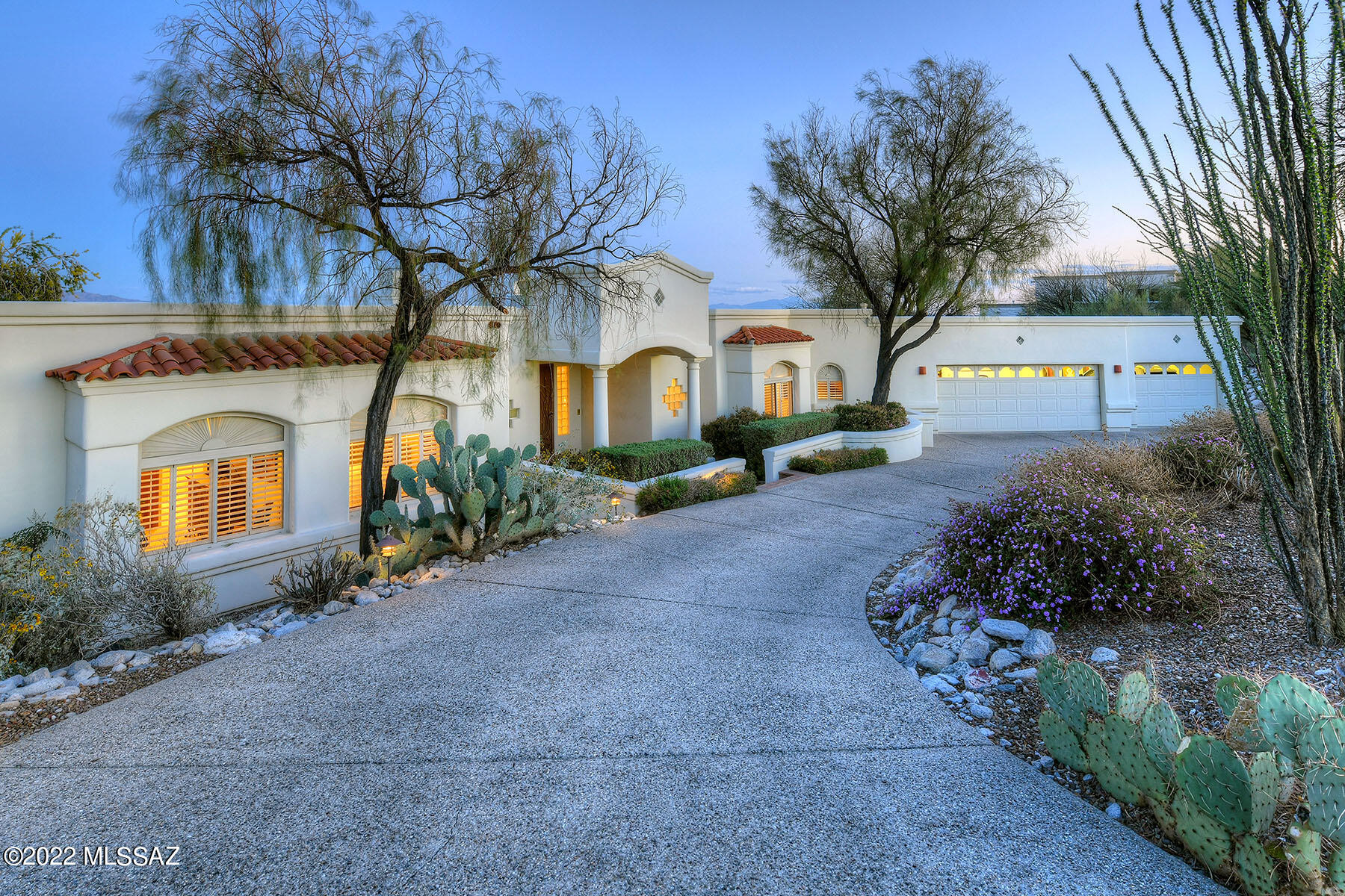 On a high Catalina Foothills 1.03 acre view lot, this 4BR, 3633 sqft home is located in prestigious, guard gated Hacienda Del Sol Estates. Combining Mediterranean and southwestern styles, enter into living room with fireplace and French doors leading to the rear yard. Cozy family room/kitchen features beamed and planked ceiling, fireplace and kitchen with granite counters, breakfast bar, stainless steel appliances, walk in pantry and adjacent dining room. Master  suite has dual vanities, expansive walk in closet and access to the rear yard, which offers outdoor living patio, Pebbletech pool and spa with waterfall and lush rear plantings. 3 car garage, District #16 schools and so much more....see to appreciate.