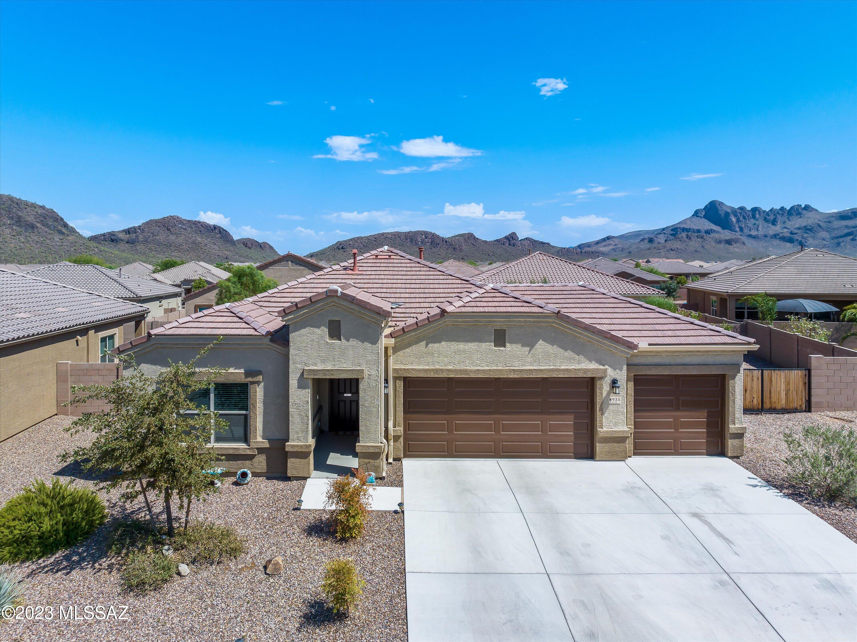 Incredible chance to assume a low 2.5% loan for this outstanding gated Marana home, the ''Earhart'' model nestled within the enchanting 55+ Saguaro Bloom Community. This 2-bed, 2-bath residence offers a vast lot with ample space for a pool and boasts a convenient 3-car garage. The kitchen is a true delight, featuring elegant granite countertops, stainless steel appliances, and an inviting open layout. Step outside onto the charming patio adorned with interlocking pavers, perfect for unwinding or hosting gatherings. Enjoy the warmth and ambiance of the fire pit during cozy evenings. Additionally, this home is ideally located near one of the many nearby parks, and it's just a short stroll to the fabulous community pool and recreation center. Noteworthy upgrades include: 8-foot front and slider doors, LED ceiling lighting in all rooms, and a dedicated 20 Amp circuit in the garage. Experience modern living in this remarkably energy-efficient property, nestled in a sought-after gated community, conveniently close to shopping amenities.
Don't let this opportunity slip away; make this Marana gem your very own!