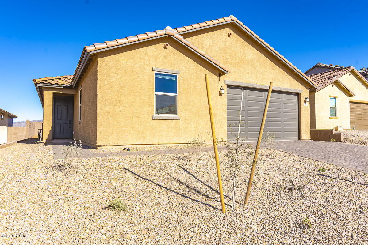 Was $274,071 now $265,990 limited time sales price. Price subject to using builder's preferred lender.  This home includes a spacious den complete with cable and internet connections. The kitchen will impress with included stainless steel appliances, 42-in upper cabinets in the color Twilight, and laminate countertops. The super bath includes a large garden tub and separate shower. Bath 2 includes an extended vanity. This home has tile throughout with lush carpeting in the bedrooms. This home comes complete with window blinds and surround sound speakers. Step outside on to the included covered patio perfect for entertaining. Live in the nationally recognized Vail School District. This home is move-in ready.