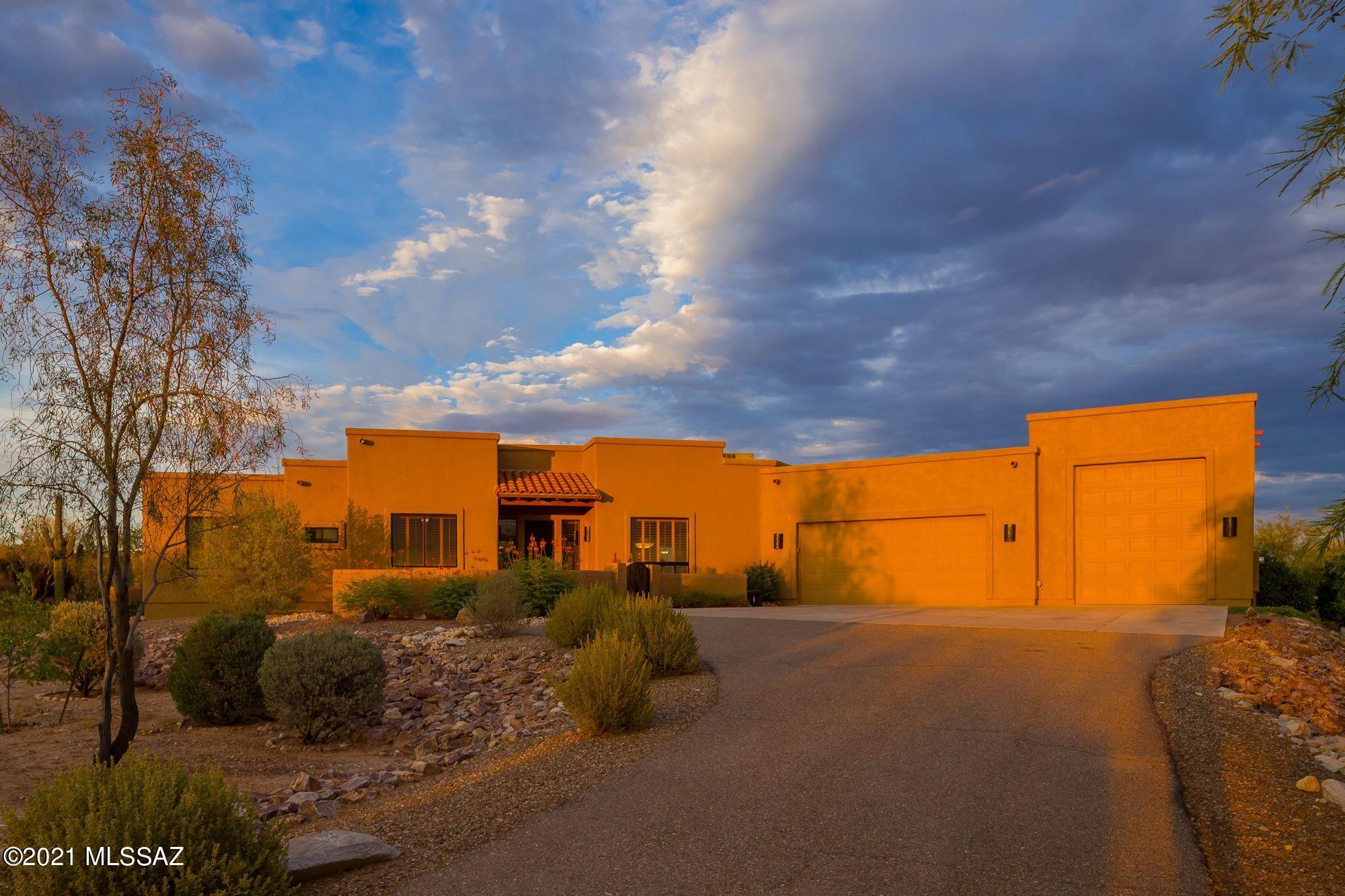 Exquisite, private, custom resort like southwestern 3000+ sqft home on 3.57 acres. Tucson Mountain and Tortolita Mountain views from the coutyard, Tortolita Mountain and Catalina Mountain views from full length east facing back patio. Pebble sheen self cleaning salt pool, custom desert security screen doors, skylights throughout including the garage, custom shutters, open 9+ foot ceilings, wood burning fireplace in the family room, gourmet kitchen with granite counters, icon stainless appliances, eat-in breakfast area, formal dining room, custom alder cabinetry throughout, solid alder wood doors, elegant private newly remodeled master bath, free standing tub, oversized walk-in rain shower, his and her closets, designer faucets, ceramic tile floors. Mature desert landscaping & citrus trees