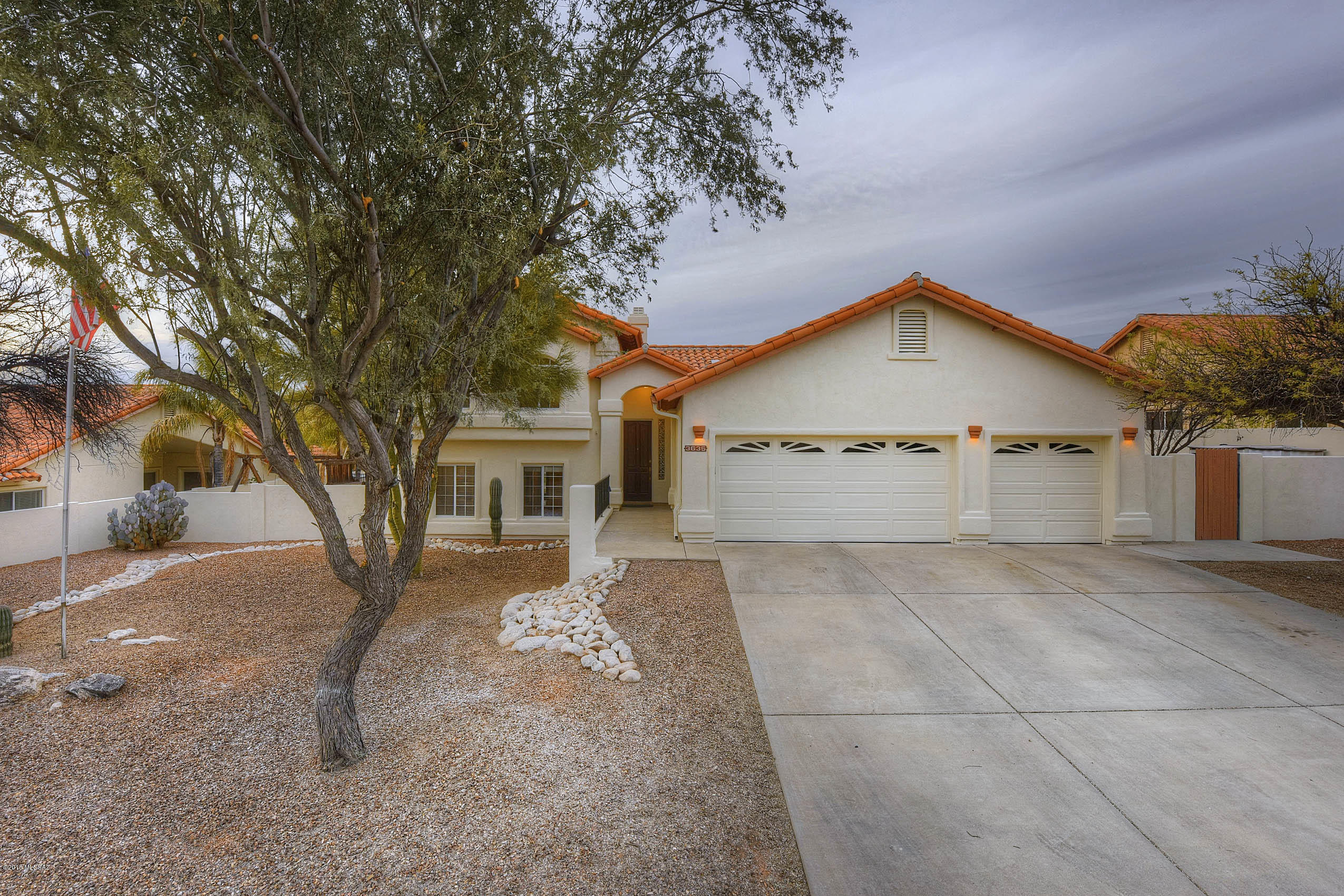 SPECTACULAR MOUNTAIN VIEWS! A resort like back yard that you will enjoy year round! Sparkling inviting pool with raised spa and waterfall. Covered patios to enjoy the shade, lots of cool decking for sun bathing, outdoor fireplace for cool evenings. Fruit trees and a North/South orientation. Paradise awaits. JUST painted inside and out. Hard to find 5 bedroom with 3 baths and 3 car garage. Split bedrooms offers lots of privacy and a versatile floor plan. High ceilings, bay windows, tile floors and all in a great neighborhood. Eat in kitchen with a pantry, granite countertops and upgraded appliances.