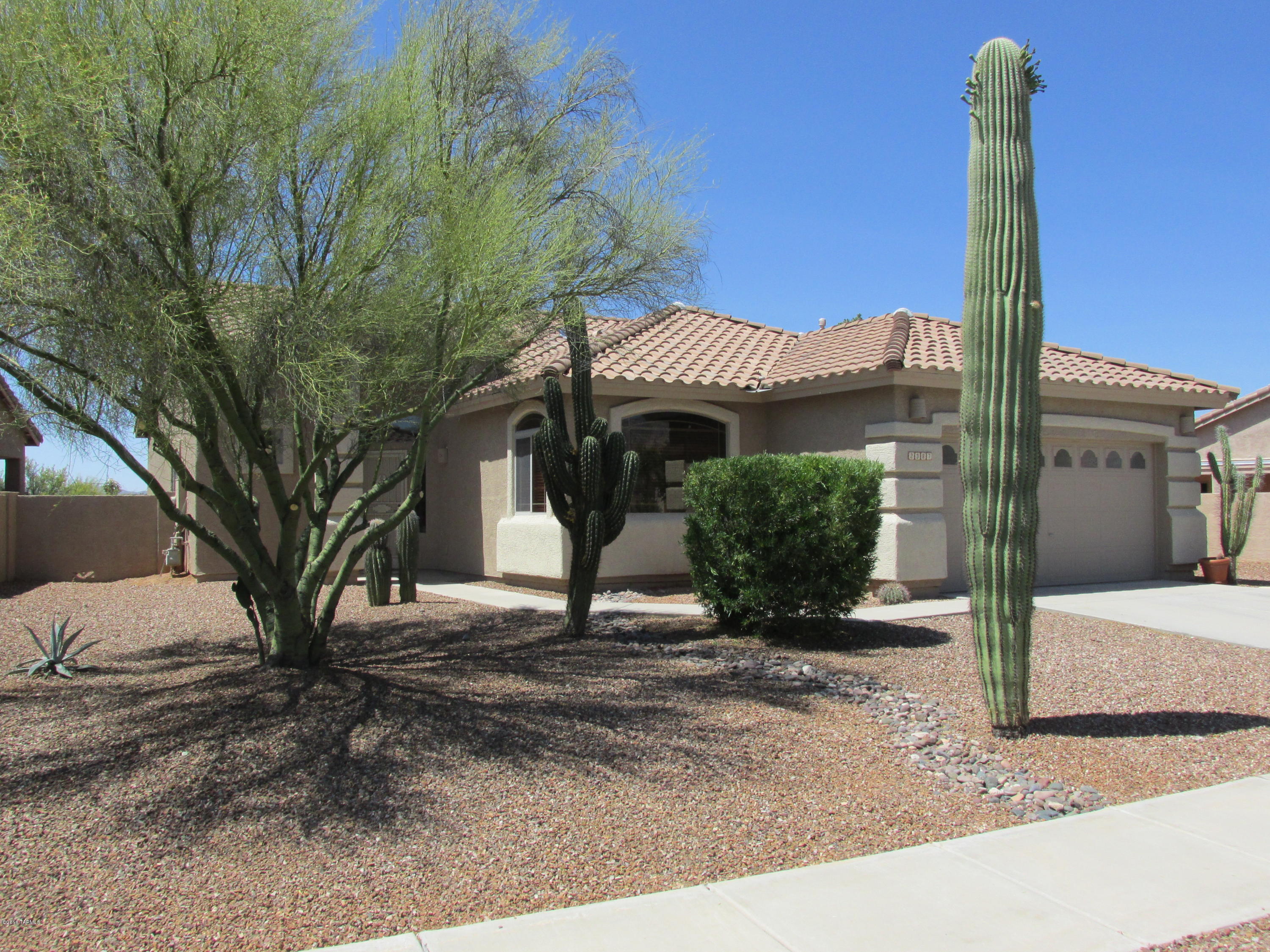 Sharp 1711 SQ FT 2 bedroom 2 bath w/ a den sports a great room floor plan and backs to a lush desert common area w/ mountain views. This home has new interior paint and exterior was painted a year ago. New stainless steel appliances adorn the spacious kitchen that features an island and pantry. The great room includes a ceiling fan, tile floors, and gas fireplace. The bedrooms and den have new carpet and ceiling fans. The master suite features a slider to the patio and the master bath shower has been upgraded and the vanity has new granite counters and new sinks. The garage has a side yard door and a utility sink. This charmer will not last!