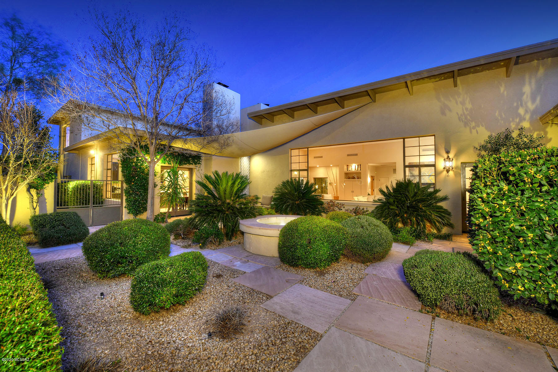 Spectacular Joesler perfectly sited on 3.5 acres, so beautifully updated it was featured on Opera Tour, Tucson Botanical Gardens & National Horticultural Society Tours!  Enter via private gated courtyard, & your first view is of the vast picture window that perfectly frames Finger Rock; gleaming wood floors originally used between truss cords in an abandoned airplane hanger & re-purposed as art-under-foot, 14 ft ceilings, wood-burning fireplace w/show-stopping hearth, chef's kitchen w/stainless steel counters, custom wood cabinets, a 2nd fireplace, ss appliances & and 8x6 ft window overlooking majestic saguaros & the Catalina Mtns beyond. One guest rm is a 2nd master suite w/city & mountain views, sitting area, en suite bath,& view balcony; ***(SEE MORE DESCRIPTION FOR IMPORTANT INFO)*** Master Suite (our favorite room!) is lined w/windows overlooking the lush courtyards.  Features include architectural designed steel ramada & wrap-around deck, 4 foundations, 3 courtyards, bocci court, sparkling pool & view-oriented spa, deluxe critter-safe dog run, fruit trees, herb garden, and package INCLUDES 3 DIVIDABLE LOTS. All just a stone's throw from La Encantada in a prime foothills location.  Also available with just 2.65 acres at a reduced price of $1.35m.  See "Child" mls listing to this Parent listing.  ALL PUBLIC HEALTH  PROTOCOLS FOLLOWED FOR EVERYONE"S SAFETY & ENJOYMENT