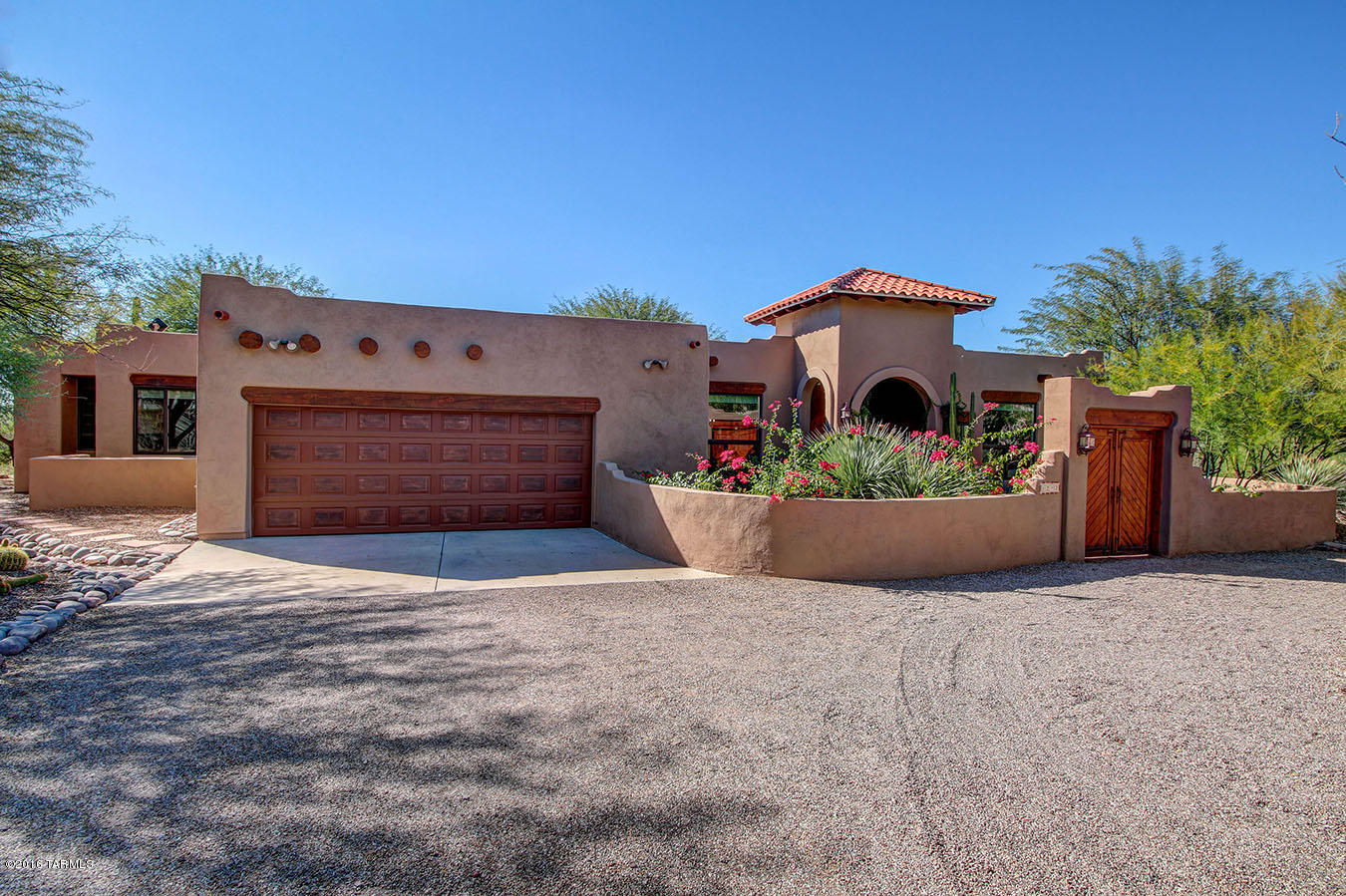 Enjoy Arizona sunsets in private resort style home located at end of cul-de-sac on almost an acre. Stunning Mountain Views from front and back. Newly Remodeled Pebble finish Pool and Spa surrounded by lush landscaping and secluded Fire Pit. This Sante Fe home has Open Floor Plan with Updated Stainless Chef's kitchen, Great Room with Wood Beam ceilings, Living Room and Formal Dining room. Master Suite has Kiva Fireplace, 3 Large Closets. Located in desirable Catalina Foothills School District. Amenities: Central Vac, instant hot water recirculating pump, AZ Room and Patio misters. Recent Upgrades: NEW Roof, 23 Double Pane Low -E window units, NEW Paint Exterior and Interior, Kinetico Water Softner & Purifier, NEW Hot Water Heater, Rogos Concrete Floors. See Attachment for list of Upgrades.
