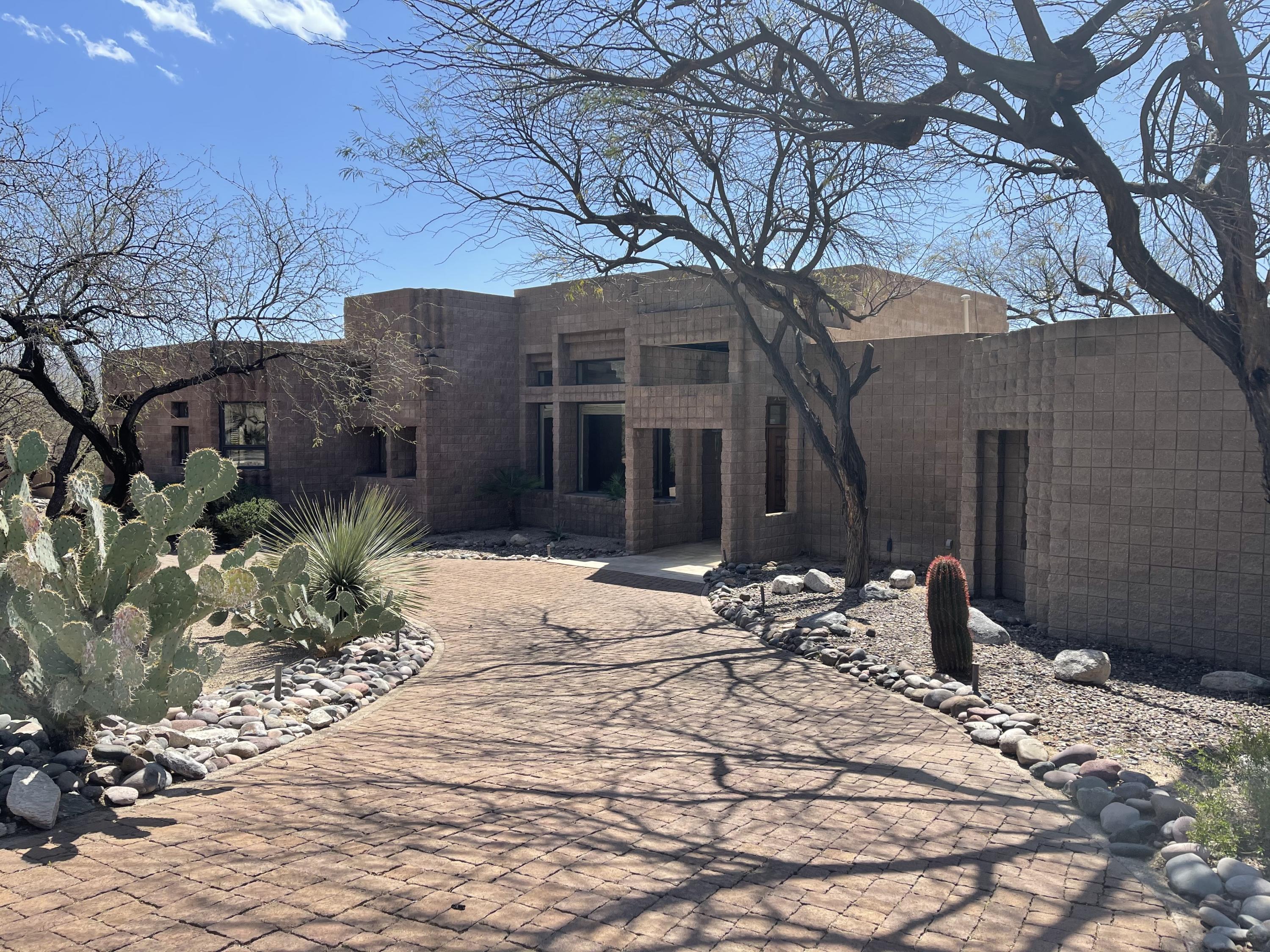 Investor Special! Tons of Potential. Located on Ventana Canyon Golf Course (Tee 1).  Come see this contemporary custom home with dramatic entry, open Light Floor Plan, High Ceilings, travertine stone floors. Put your own special touch to make it your very on dream home. All bedrooms have private baths. Mountain and Golf views plus city views from mster balc.