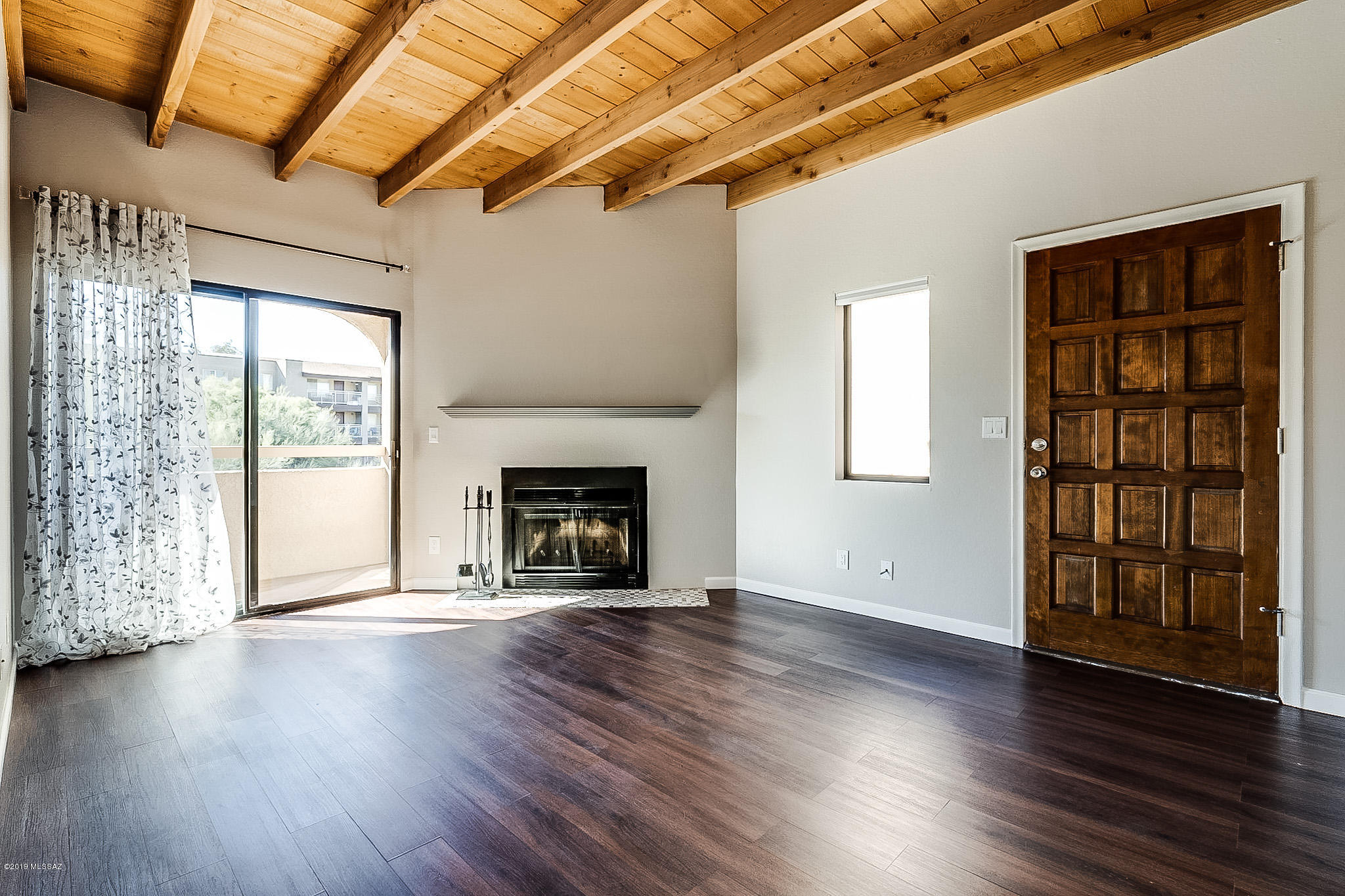 Beautifully updated move-in ready condominium with spacious open floor plan located in the heart of the Catalina Foothills!  Generously sized 2 bedrooms and 2 baths, wood beam ceiling, wood burning fireplace and private balcony. Open kitchen with new counter tops and stainless-steel appliances. Updates include cabinets with beautiful backsplash, freshly painted interior, new flooring, tile work, faucets (bathroom ones light-up), lighting, ceiling fan and blinds.  Great location close to shopping, restaurants, hiking and biking. Make sure to visit the courtyard which features a heated community pool and spa, beautifully maintained grounds, clubhouse and gas BBQ grills. HOA fee includes roof/building maintenance, grounds, parking area, pool, spa, water, sewer, trash and termite warranty.