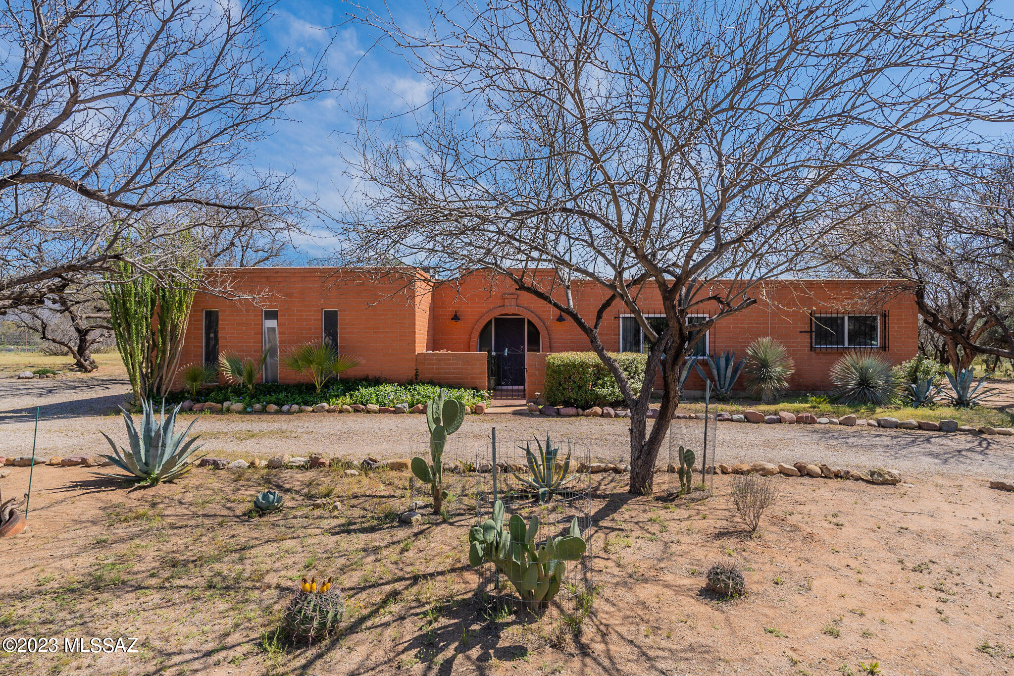 Come enjoy the serene living in Bel Air Ranch Estates in the Tanque Verde Valley. This ranch home sits on almost an acre lot(.98), w/ pebbletec pool, spacious split floorplan 4 bedrooms & 2 baths has been tastefully updated. The seller is going to miss her bakers delight of a kitchen with 3 ovens, Thermador cooktop, farm sink, pantry and ample cabinetry & fireplace. Large living room has Catalina mountain views, Additional Flex Space off Laundry, can be office, homeschool, crafts, artist studio, etc. Ample Closets throughout home. No carpet! HVAC and water heater replaced, plus Voluntary HOA!  Plenty of space on the lot to add additional garage, workshop, guest house, etc. Tanque Verde Schools. This is a well appointed home with many amenities, schedule a private showing toda