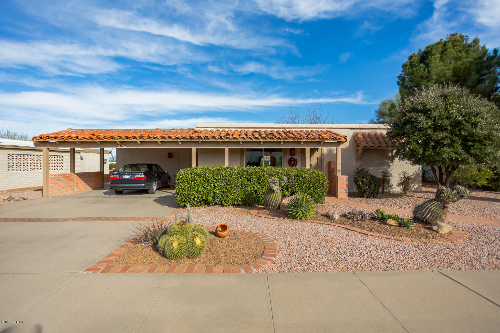 A real doll house with a separate guest casita! You will love this classic ranch style home from the moment you arrive. Extremely well maintained and has double pane windows installed throughout the home. The front porch is shielded by manicured desert shrubs and cactus islands to offer a perfect place to relax while keeping a casual eye on the neighborhood. You will enter into a traditional living room featuring arched passageways leading into a separate kitchen with crisp white cabinetry, designer painting, a brilliant skylight and an eat-in dining area with backyard views. Your master bedroom and bath display custom paint colors and plantation shutters. Step out onto a tiled patio that extends into a huge backyard with a flagstone dining area surrounded by mature desert shrubbery and a majestic Pecan tree. This home is being offered furnished by separate bill of sale - just pack your bags and move right in!