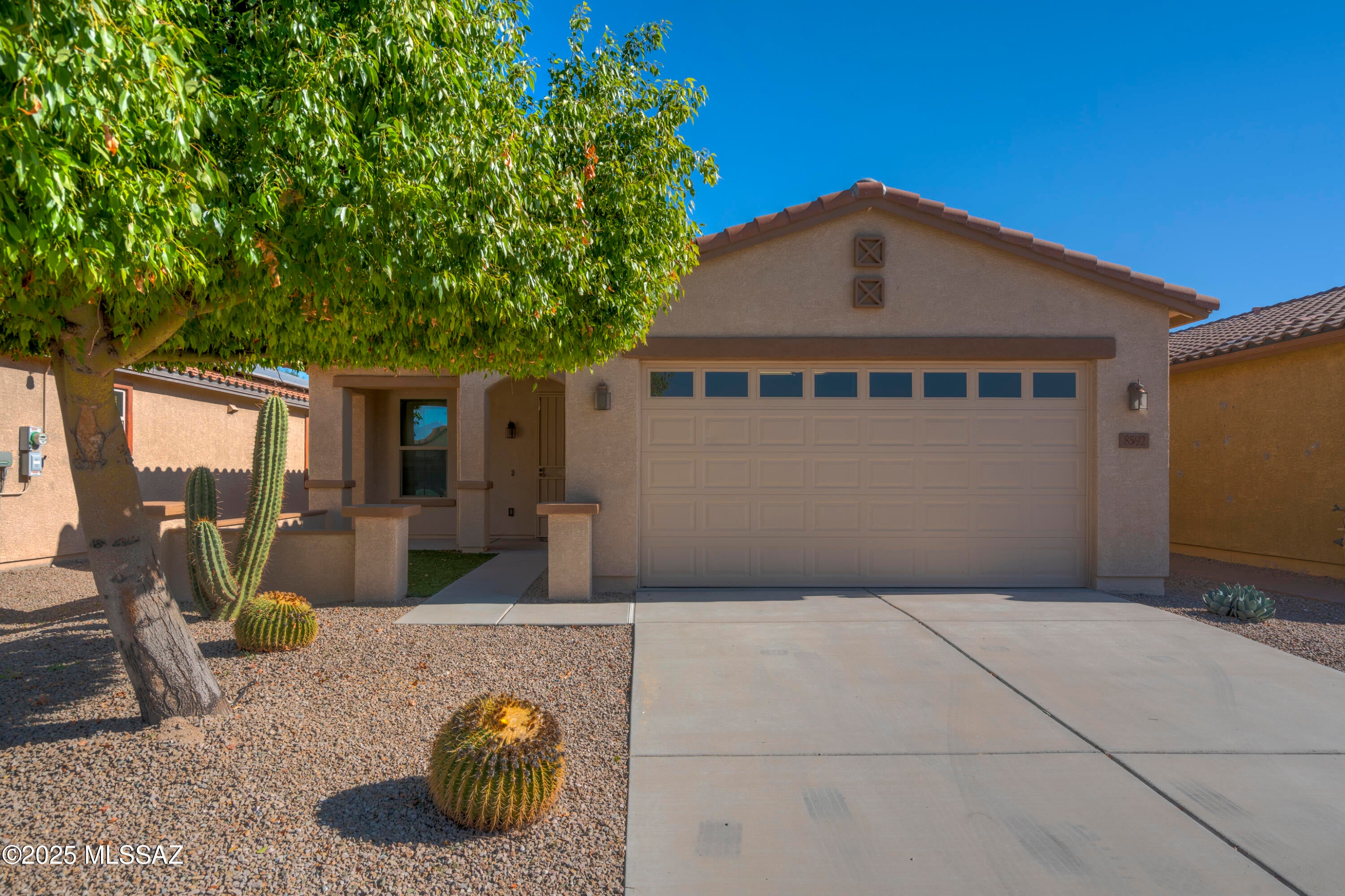 Gated community w breathtaking views overlooking Quarry Pines golf course & a Catalina Mountain backdrop. Wonderful, open floor-plan 3 bed, 2 bath move-in ready home. The well-appointed kitchen w granite counters & stainless steel appliances is open to the great room & dining nook. The large primary bedroom w walk -in closet overlooks the rear yard & has fantastic views of the 9th hole. The split floor-plan positions the guest bedrooms & bathroom off of the entry hallway. Both bathrooms are nicely appointed in oil-rubbed bronze fixtures. Fridge, washer, dryer, water softener included. Cabinet doors feature soft-close hinges. New interior and exterior paint, new carpet and a new roof! Minutes to shopping, restaurants, movies & more & prime positioning for commuters near Cortaro & I-10.
