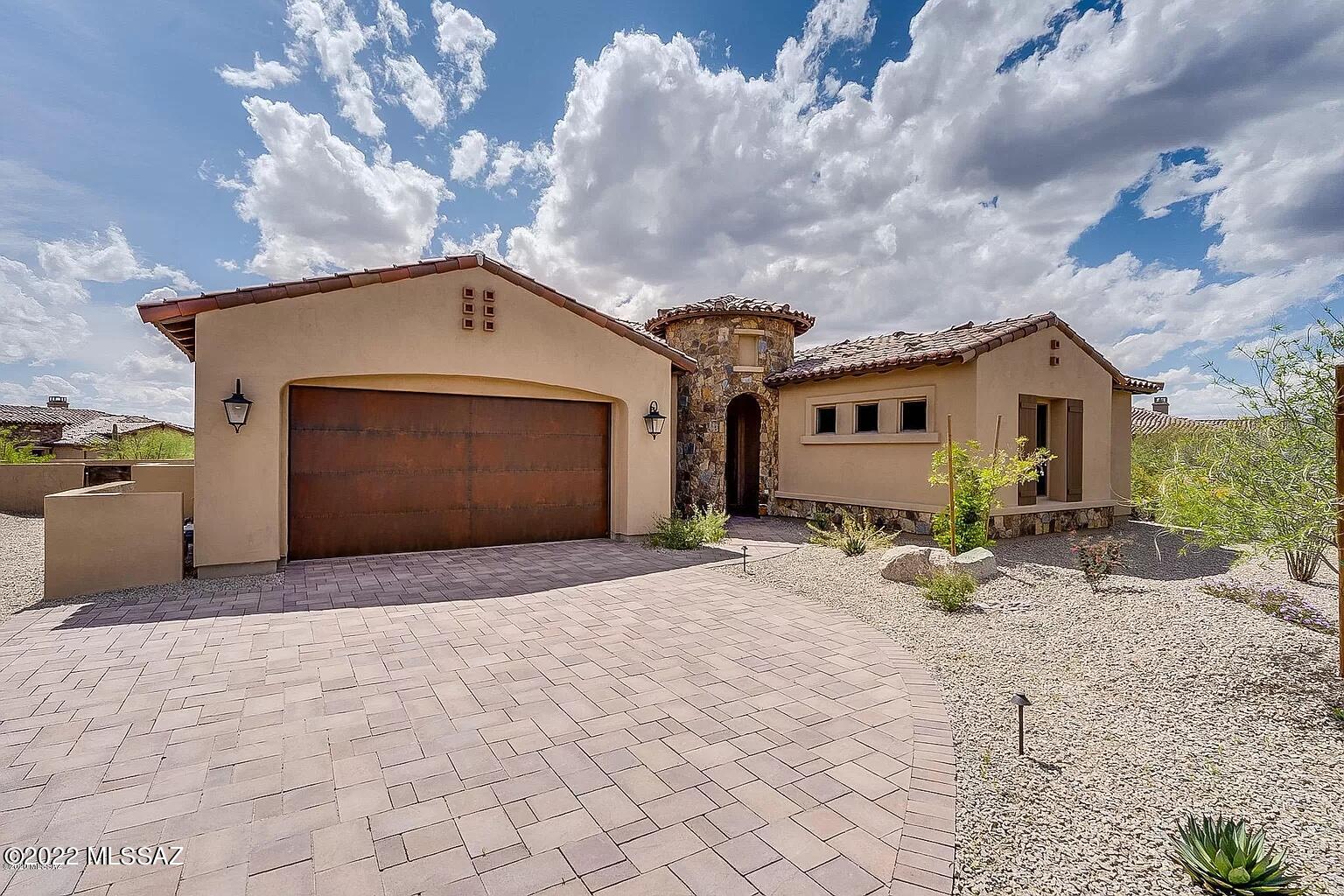 This home features a functional split floor plan with 2 masters, a third bedroom with attached bath, an expansive den, powder room, open concept living and a 3 car tandem garage. Situated close to the gate for easy coming and going, and within a mile of the club, golf course, gym, pool and tennis courts. Within 5-10 minutes, you will find incredible single track mountain biking & running trails, excellent road cycling routes, ''The Loop'' path, gorgeous hiking, shopping and medical facilities.