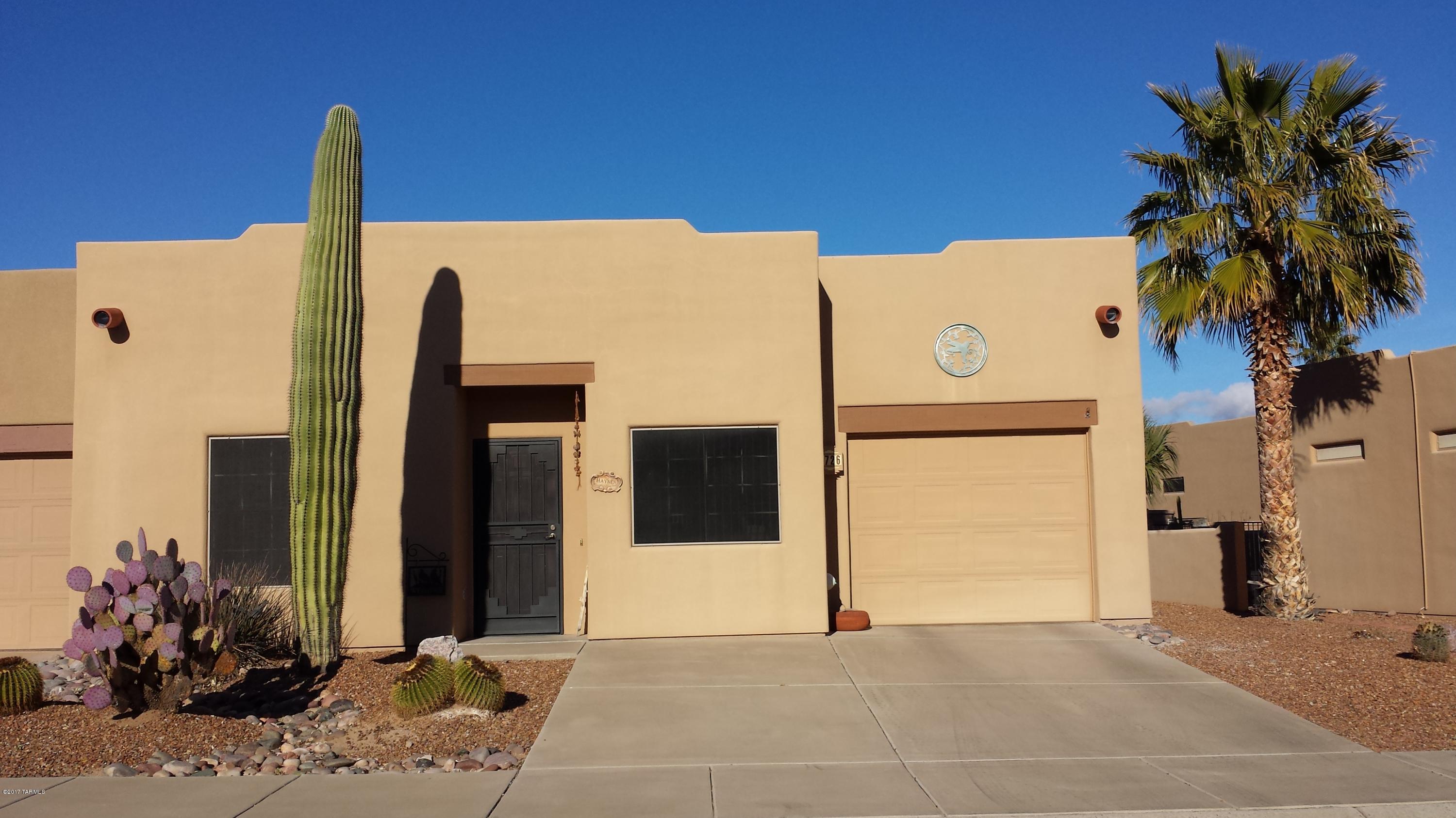 Well maintained 2 BR, 2 BA townhome in the gated community of The Springs. April 2016 new A/C, Aug 2016 new patio cover, Oct 2016 roof recoat.  Tile throughout most with carpet in BR. Ceiling fans and skylights.  Hallway linen closet. Pull up a couple of barstools to the counter or enjoy a meal at the dining area.  Walk to the rec center, pool/spa, and walking paths.
