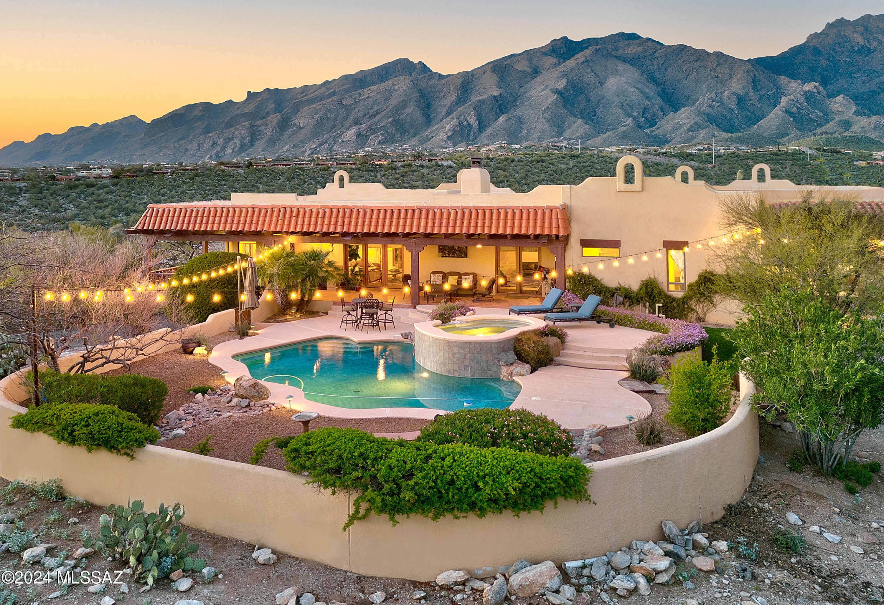 Stunning ridgetop home w/360° views  on almost 1 acre in desirable Sunrise Territory Village. Lushly landscaped front courtyard w/sparkling fountain, foyer entry, exquisite Great Room w/ elegant fireplace, walls of windows, travertine tile floors, formal dining rm, gourmet island kitchen w/white cabinets, glass front cabinet doors,  granite countertops, stainless steel appliances, breakfast area, beautiful wood floors, office/media room w/fireplace, 5 large bedrooms & 5 sensational baths, primary bedroom w/sitting area, lux. bath w/ double vanities, tile countertops, large glass enclosed shower. Laundry room, wood cased windows, workshop, charming wrap-around covered patio, pool, spa, 4 car garage, majestic city, mt., sunrise & sunset views, Dist.16 schools. What more could you want!