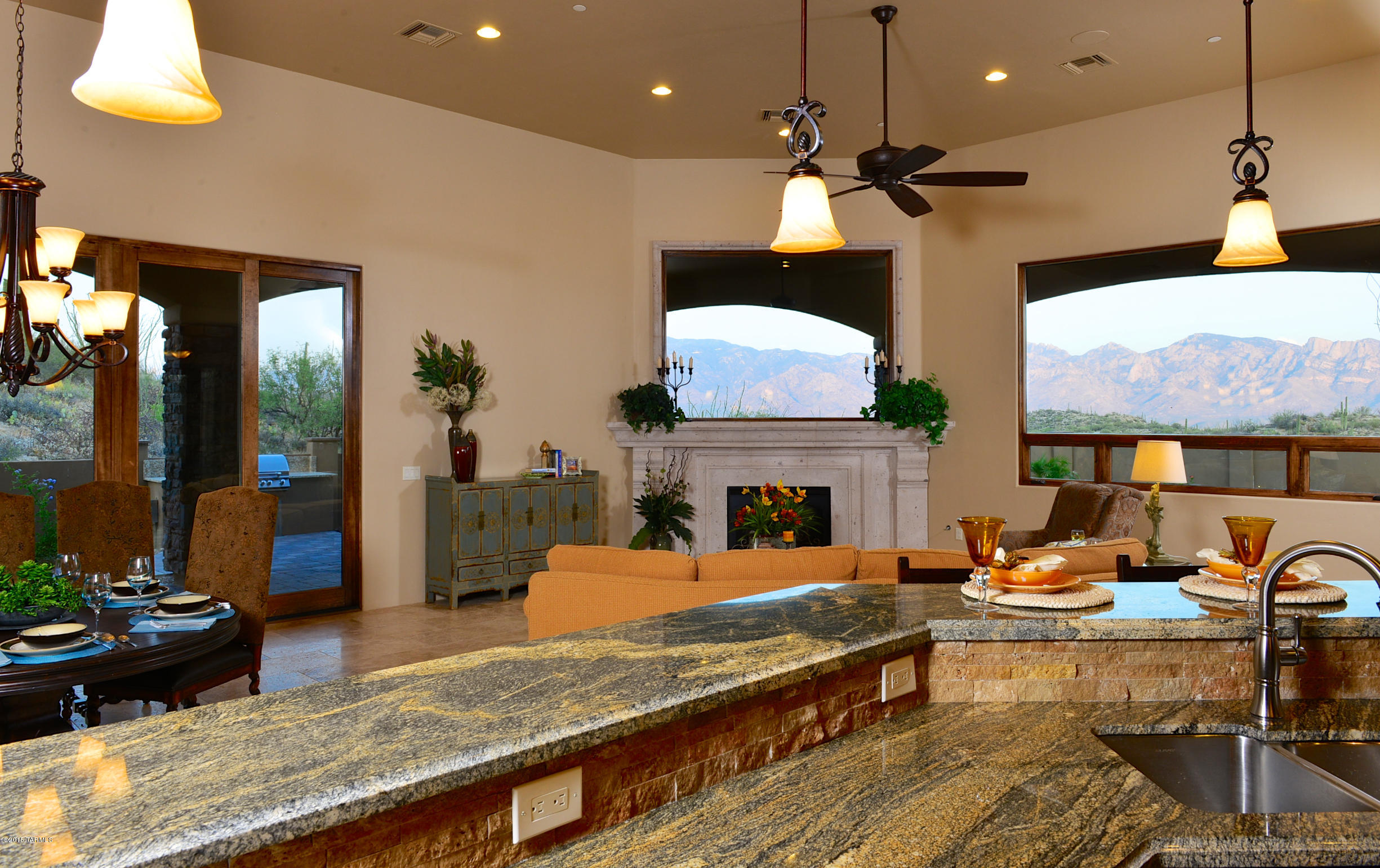 Enchanting Stone Canyon jewel with modern Mediterranean flair! Timeless and charming 2,832SF 3BD/3BA great room style golf retreat with lovely mountain views and gorgeous rock & saguaro-studded desert backdrop. Inspired by Tuscan architecture, this delightful desert treasure offers dual masters, a spacious great room, marvelous kitchen and upscale amenities. L-shaped covered patio offers options for outdoor enjoyment including putting green and built-in BBQ (room for spa/pool). Chef's kitchen with lava granite, cherry walnut cabs, Sub-Zero, Wolf 48” gas cooktop & dual ovens, Sharp M/W drawer, Bosch D/W, prep island w/sink plus Thermador wine ref. Located in Phil Mickelson’s premier golf community in Oro Valley, the Scottsdale of Tucson. Perfect for a seasonal or annual lifestyle!