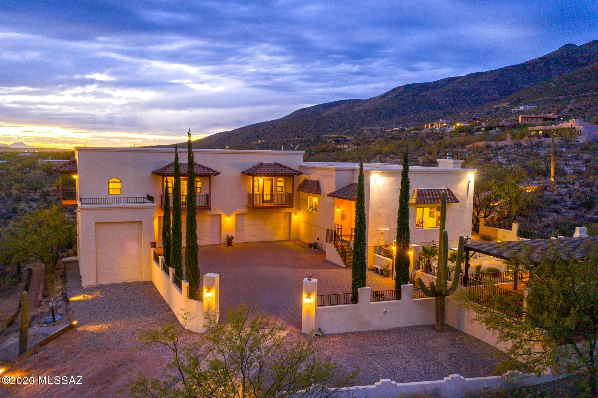 GATED COMMUNITY ON 3.43 ACRES OF BEAUTY! BUILDER OWNED HOME!...QUALITY THROUGOUT...QUALITY ATTENTION TO DETAIL & FUCTIONALITY!...AND OH, DON'T FORGET THE BEAUTY OF THE LOCATION AND LANDSCAPING!..FROM LANDSCAPING LIGHTING...TO WATERFALLS...TO PONDS, THIS HOME IS BETTER THAN JUST GOOD...IT'S BEAUTIFUL AND ENCHANTING.  THE VIEWS OF THE MOUNTAINS ARE BREATHTAKING...WHETHER AT SUNRISE, OR SUNSET, IT'S LIKE ''HEAVEN ON EARTH''
THE INTERIOR IS STUNNING!  FROM THE NATURAL HARDWOOD FLOORS  TO THE 5 CAR GARAGE!  DID WE SAY 5 CAR GARAGE...WE DID...AND ONE IS BUILT TO HANDLE A 30 FT RV.  THE KITCHEN IS DESIGNED FOR A CHEF.  THIS QUIET RETREAT PROVIDES PRISTINE VIEWS OF THE MILKY WAY AND THE BEAUTY OF SOUTHERN ARIZONA.