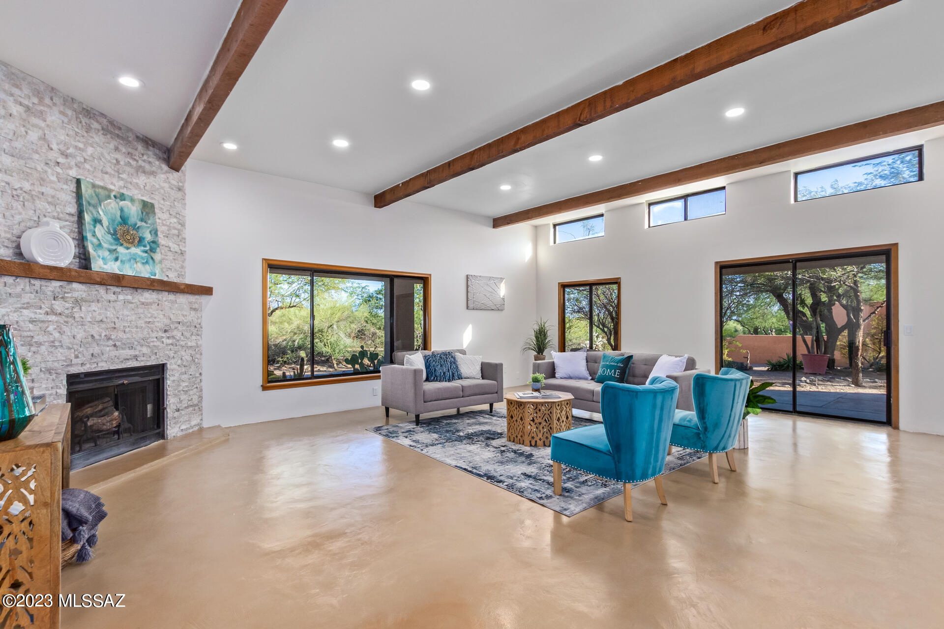Enjoy this elegantly renovated residence, nestled in the heart of the Catalina Foothills with breathtaking panoramic vistas. The kitchen has been transformed with the inclusion of brand new, sleek antique cabinets, quartz countertops, stainless steel appliances, copper fixtures, and an exquisite hammered copper sink that captures the eye. Inside, a fresh ambiance is cultivated with newly applied paint, and updated fixtures. The bathrooms have undergone a lavish transformation, adorned with sophisticated antique white vanities, gleaming quartz countertops, a pristine shower and bathtub surrounded by tasteful tile work, modern fixtures, elegant vanity lighting, fresh sinks, toilets, mirrors, and stylish towel bar sets. The exterior of the home exhibits revitalized body and trim paint, an upgraded concrete overlay, and effortlessly maintained landscaping for a low-maintenance yet picturesque outdoor setting. Agent owner.