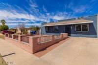 Completely Remodeled over recent years, Move-In ready 3 Bedroom / 2 Bath Home featuring 16'' Ceramic Tile thru out with Laminate/Colored Concrete in Bedrooms, Kitchen Remodel (3 1/2 yrs ago) includes Cabinets, Granite Counter Tops & Stainless Steel Appliances, Bathrooms Remodeled (4 Yrs ago) with Vanities, Tub / Showers. Additional upgrades include Water Heater & Lighting / Fan Fixtures, All Flooring, Doors, Fixtures, 5 Light / Fan Fixtures, Screened in Back Porch with Laundry / Storage Room, Fresh Interior & Exterior Paint, Fresh Landscape Rock in Back Yard. Everything has been done!!! Hurry! this won't last long.
