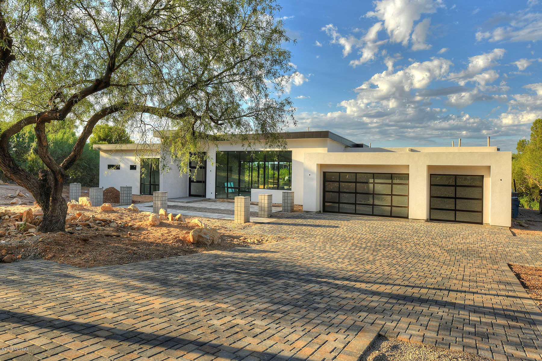 Completely re-built from the ground up! This stunning, custom built, modern home in the prestigious gated community of Skyline Country Club has amazing views from every room! Set-back on a large private golf course lot, the floor to ceiling walls of windows captures the sprawling views. Incredible floor plan, this home is absolutely gorgeous w/ the latest appliances, light fixtures & finishes. Retreat to your master oasis enjoy your spa-like master bath or relax in your new gorgeous pool & spa as you take in the incredible views. Every detail has been accounted for from the stunning bathroom tile & back splash, to the gorgeous closet & pantry cabinets to the intricate hall bath shower tile & out of this world light fixtures. Seller is a licensed agent in the state of Arizona. New, modern & gorgeous, there is nothing like this home in Tucson.