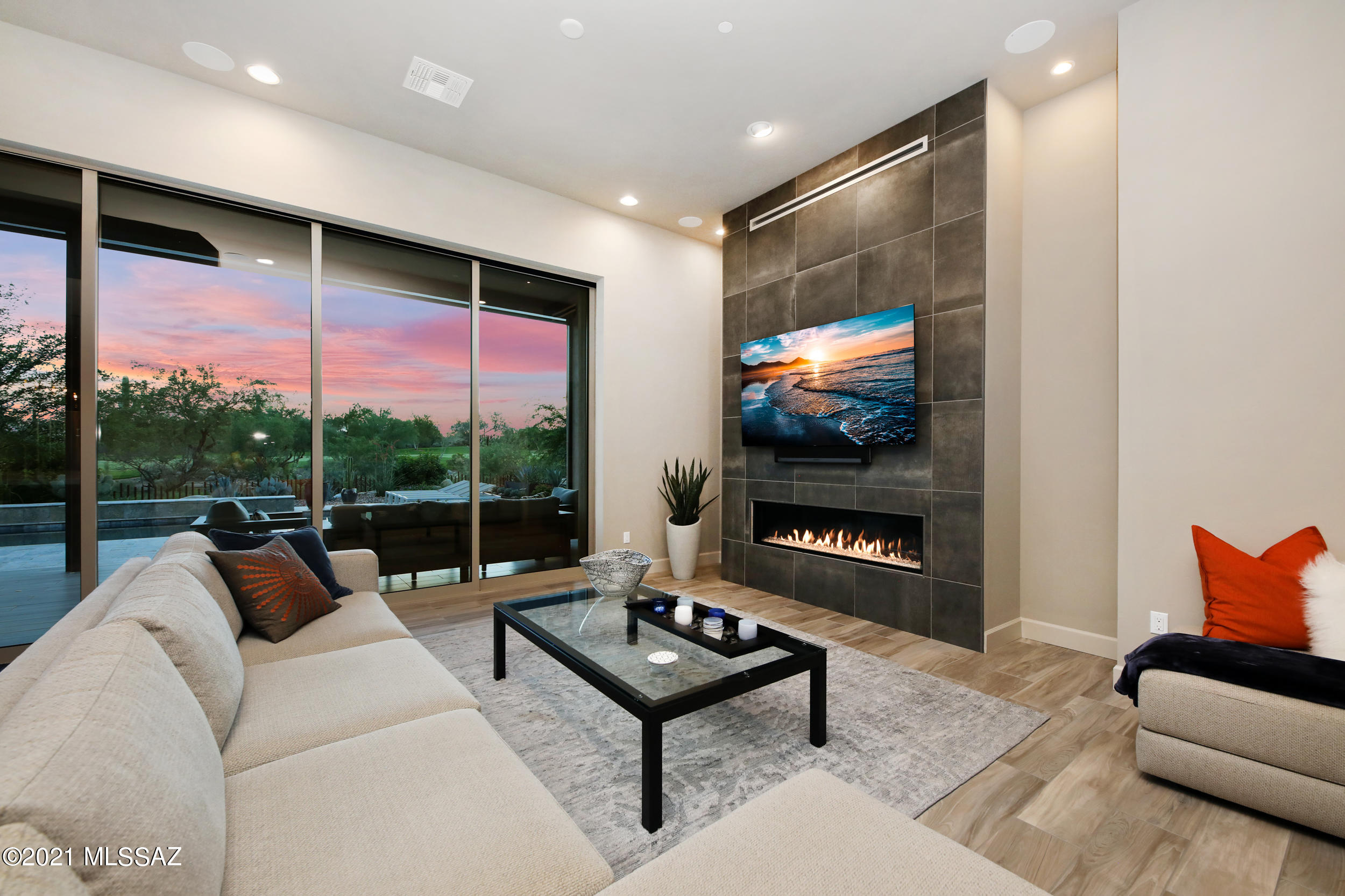 Set in the Stone Canyon gated and luxury golf course community, this contemporary-styled 3 bed, 3.5 bath home is not just exquisite but also entirely unique. Your own distinctive, private enclave nestled high in the Sonoran desert, this state-of-the-art residence is a masterpiece of modern living. Within walking distance of the Stone Canyon Health and Fitness Center, Golf Course, and Clubhouse. Take advantage of the tennis courts, pickleball, pool and the golf course, designed by Tom Weiskopf and Jay Morrish. This course is consistently ranked among the top 100 residential golf courses in the country. Experience luxury desert living with views! It is easy to see the extent to which you can recharge in the oversized master suite  a dream come true, with the zen of your own private patio and spa-inspired dual vanity bath exemplifying the epitome of a calm, restorative retreat. In addition, the desert garden tub in the master allows you a front-row experience to the priceless grandeur of the natural beauty that surrounds this property. Revel in the pristine sunrises and sunsets from your own home.

This residence is the definition of luxury, with the open concept gourmet kitchen with a generous island and sleek countertops throughout, a great room with a fireplace nestled under expansive 12' ceilings, an exclusive home office, and a tandem garage.

The low-maintenance yard includes a breath-taking golf course and mountain views. From the stone stucco finish to the 12 ft ceiling, bask in an artfully decorated space that reflects desert serenity. Sit in front of the gorgeous fireplace with a favorite drink or invite friends over for a game night.