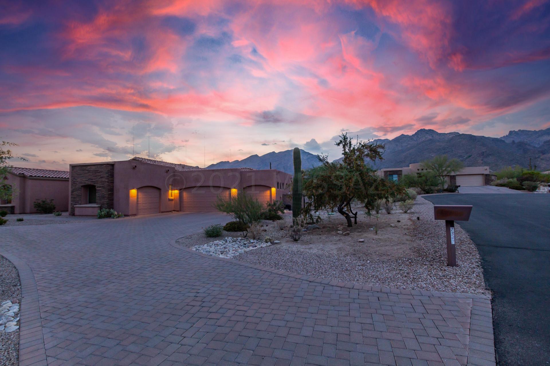 Beautiful semi-custom house in a small, gated community nestled at the foothills of Catalina Mountains. 4 car garage, driveway for another 8 cars,  a huge fenced-off backyard with incredible mountain views. 10/12-foot ceilings, picture windows in family and living rooms, all windows with amazing mountain views. Every bedroom is large and has a full private bathroom. Large open kitchen with lots of light and counter space. Upgraded spray-on insulation, hot water recirculation system, refrigerator icemaker plumbed to RO. A mile away from the Sabino Canyon Recreation Area and District 16 schools. Lots of places for walking and biking around the neighborhood. Minutes away from shopping, restaurants, golf, and art galleries. There are honeycomb double cell energy-efficient blinds on all windows throughout the house for privacy so you can enjoy your views from any room without being bothered by the outside world. If you're looking for something off the beaten path look no further as this property is located at the base of Sabina Canyon walking distance from hiking trails and close to Ventana Canyon Golf Course and it backs up to Sabina canyon and CFSD school district.