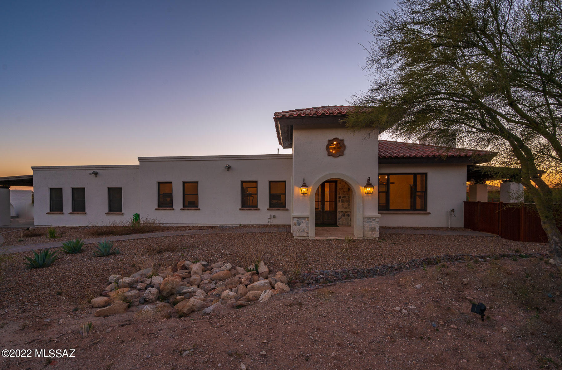 This gorgeous home is range priced $1,375,000-1,415,000. This home has amazing views of Thimble Peak and the Santa Catalina Mountains. It features a gourmet kitchen w/ high-end appliances and an over-sized island. Sophisticated travertine floors, solid wood doors/trim, exclusive light features, exposed beams and quartz counter tops are just a few of the refined touches. Guest house w/ separate entrance. This lot can be split and is zoned CR1. GREAT VALUE! You cannot replace this home for this sales price.
