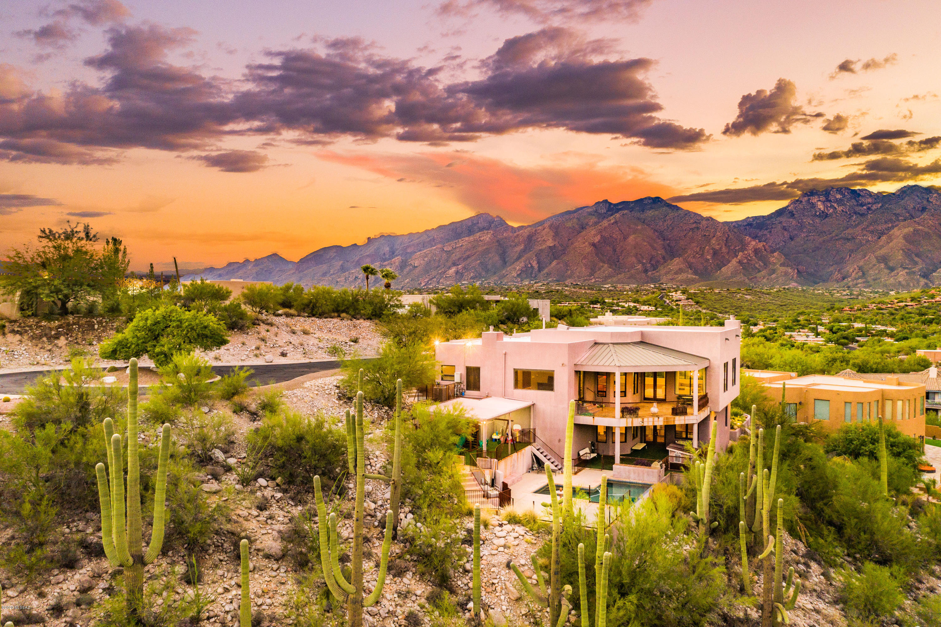 OPEN HOUSE Sunday 12-20 1-4! Stunning Foothills home with unobstructed mountain & city views! This 4,797 sq ft property includes a 4560 sf main house & an attached 237 sq ft Guest House, pool & huge covered patio. The open concept Great Room w/ fireplace is massive with floor to ceiling windows on the north and south ends, beautiful wood flooring & soaring ceilings. The Kitchen has top of the line SS Appliances, Granite Counters & a Center Island.  The Master bedroom, 2 additional bedrooms, kitchen, great room and 3 bathrooms are all on the Main Level. Lower Level has a Den area and Game Room, Laundry and a bathroom. A small Guest House with its own kitchen is off of the driveway by 3 Car Garage. The views here are amazing and the location is great! You don't want to miss this one!