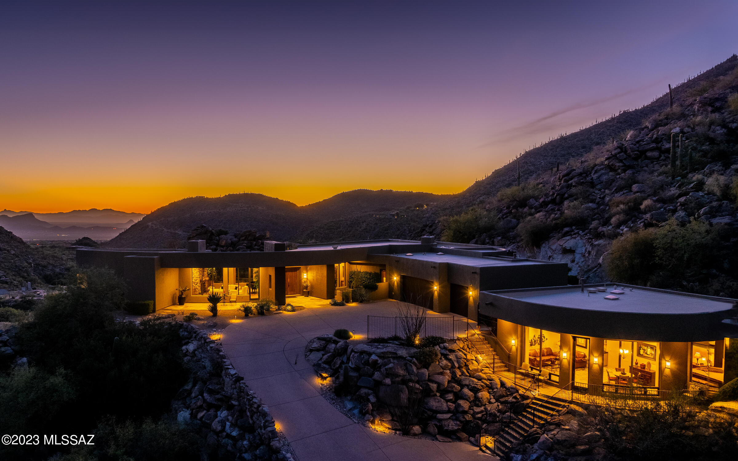 One of the most spectacular locations in Canyon Pass. Nestled into the rock outcroppings & boulders of an elevated lot, this contemporary design boasts warm finishes of stone, wood & granite  throughout. A massive Viking kitchen - view windows everywhere - dramatic walls of glass - some arched designs. Privacy abounds from master bedroom private patio - backyard entertainment areas and the spectacular guest house (that was built in 2008 by same builder as main house. HVAC systems new in 2021. Seller also added mini-split AC unit in garage.  Guest house is spacious at 945sf w/family room, dining area, separate bedrooms & bath &  mini bar kitchen area. Some of the most dramatic views of the canyon are from the guest house. This home is magnificent - sunsets are mesmerizing - architecture is stunning. Home sprawls smoothly - a soft sense of serenity. All furnishings are available - including the Steinway & Sons baby grand, a plethora of exercise equipment, tables, couches, accessories including a fully furnished guest house.  Feel free to call at any time to discuss.  Appointment required to view.