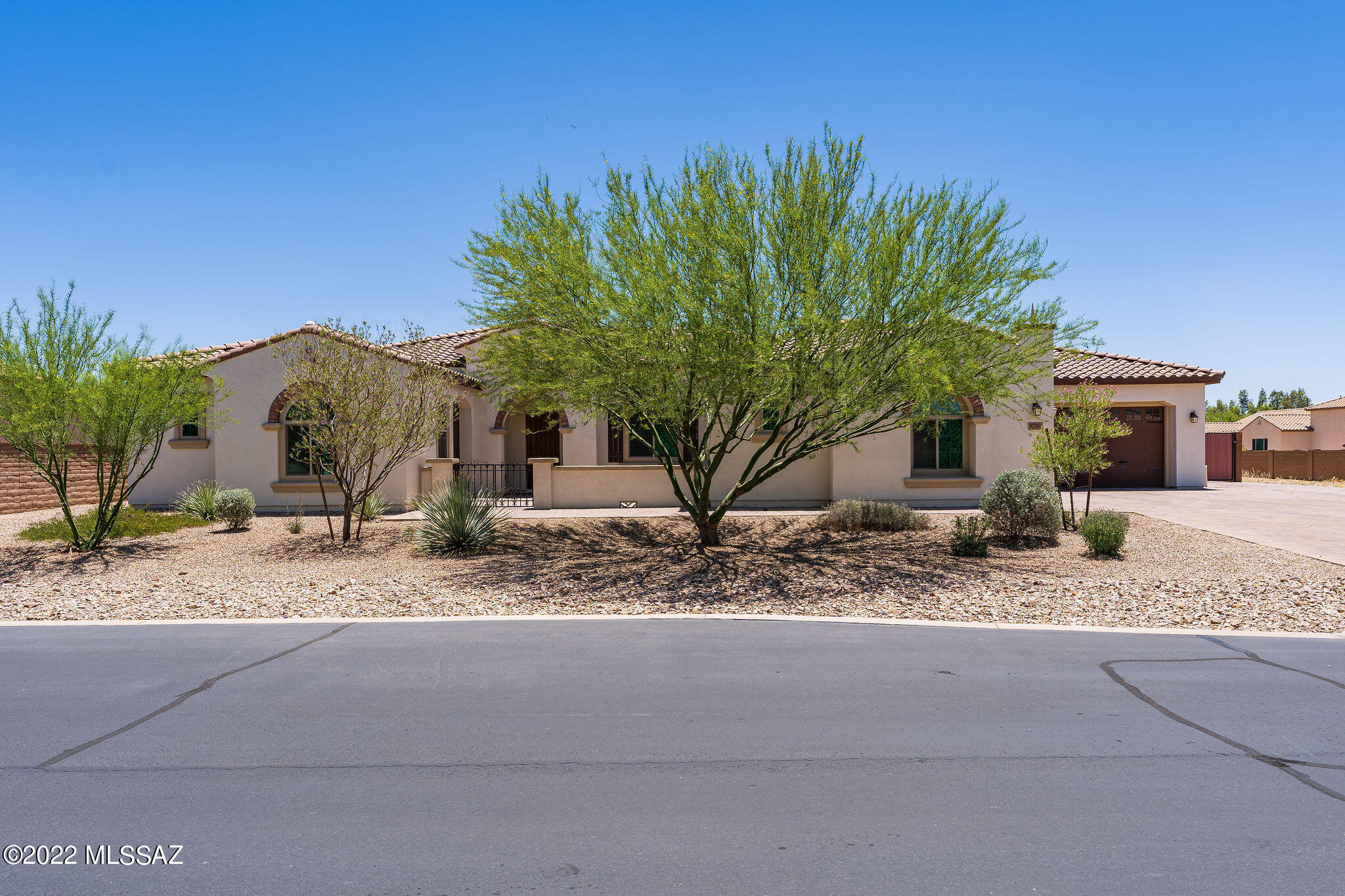Prestigious home in an upscale gated community. The large open kitchen has beautiful cabinetry,  quartz countertops, an island w/seating for 5, an undermount sink, spray faucet, pendant lights.  Stainless steel appliances which include a built in convection/microwave, built in oven, dishwasher, a gas cooktop,  hood and state of the Art (wifi controlled) French door refrigerator.  4 Car garage and on a 1/2 acre of land with mountain views. The family room is very large, separate dining room, a recreation room with bar area and sink. The guest casita has a separate entrance,  a family room w/ kitchenette ,a separate bedroom and bathroom. Master suite is also very large with a walk in closet,  Garden tub, walk in shower w/ tile surround to the ceiling, dual sinks w/quartz countertops.