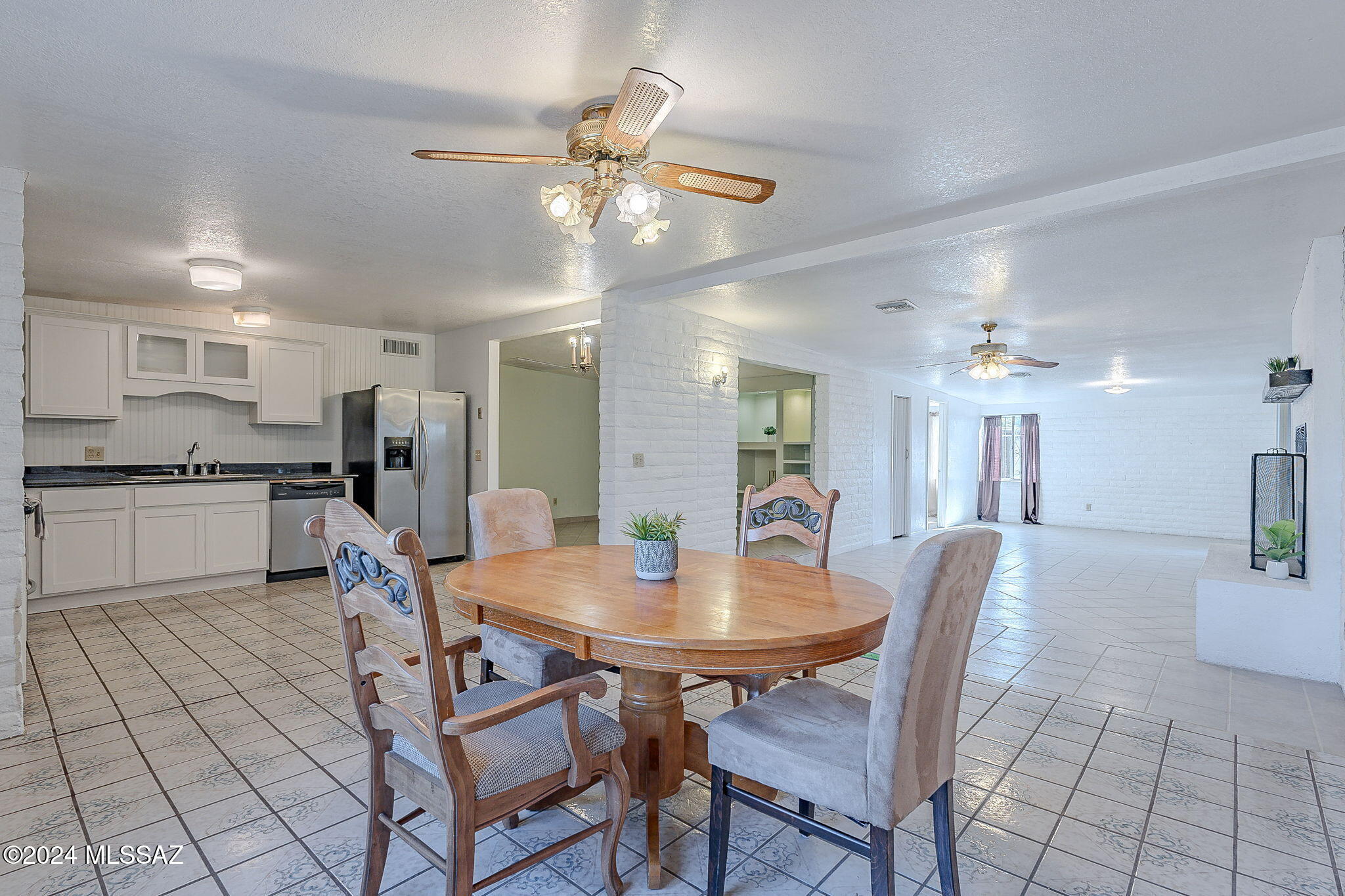 Spring refresh complete! All new exterior paint, recoated roof and electrical updates have revitalized the home and made it ready for you! This inviting 3-bedroom offers the perfect blend of comfort and versatility with an open floor plan that enhances the feeling of space and light. You'll appreciate the bright rooms and the generous space this home has to offer. Tile flooring throughout, airy layout where the heart of the home is the renovated kitchen with stainless steel appliances, granite countertops, and updated cabinetry. The garage provides space for both parking and storage, a rare convenience in this sought-after area. Great location close to shopping, dining, easy I-10 access, adjacent to Cherry Bike Blvd and Kino Sports complex is just down the way. Double gated backyard entrance could allow for storage and parking of toys and other needs.  These recent updates have refreshed and enhanced the look and durability of the home helping to offer peace of mind for the new owner.