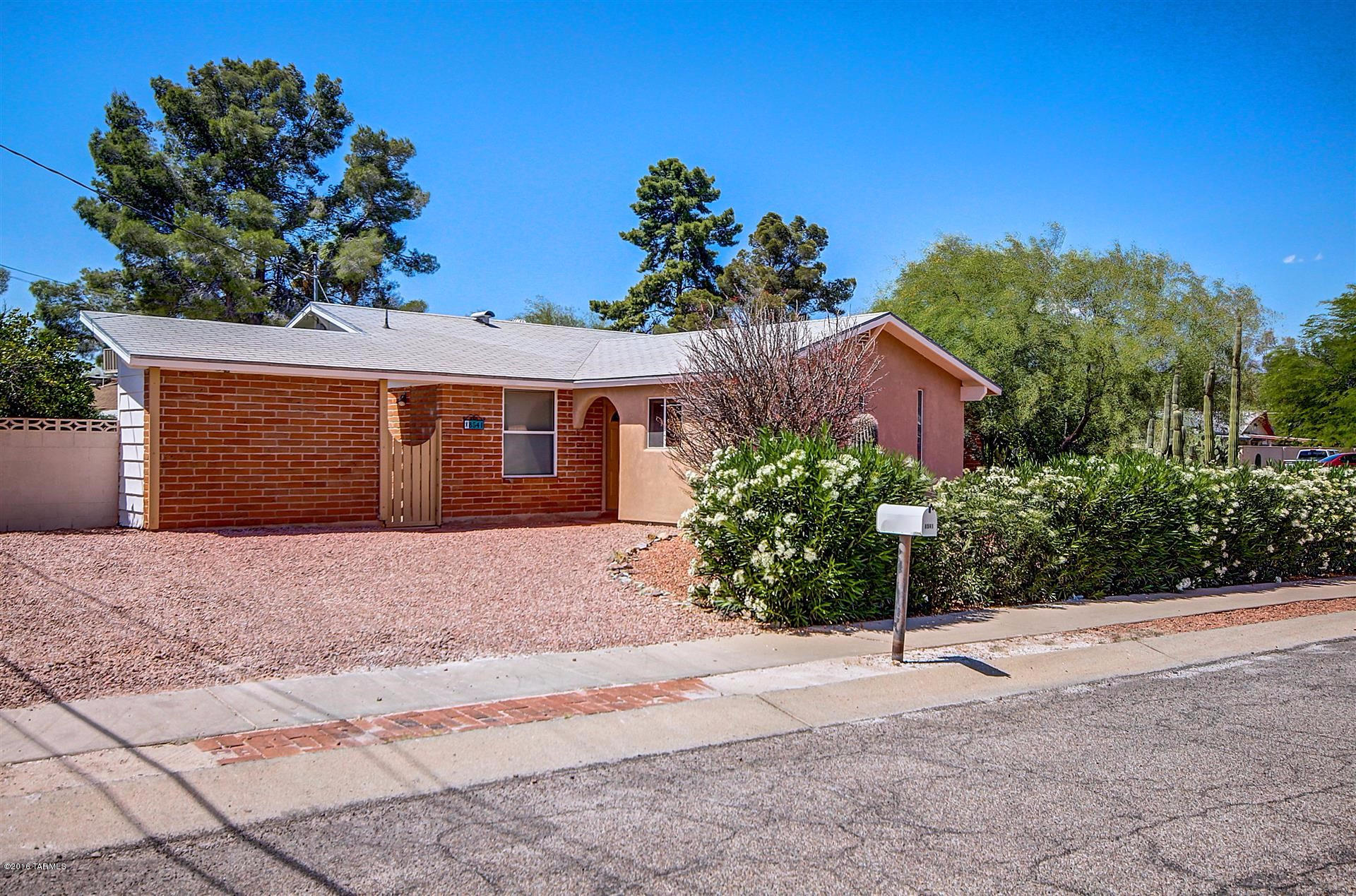This is IT! Move-in ready home on the east side!! New carpet! New Tile! Fresh Paint! This Galley style kitchen offers white appliances, custom cabinets, breakfast bar and plenty of counter space. Spacious bedrooms!! Absolutely beautiful lush mature growth in the front and a private backyard oasis has a covered patio, refreshing blue pool and a separate storage shed! Don't miss this opportunity!!