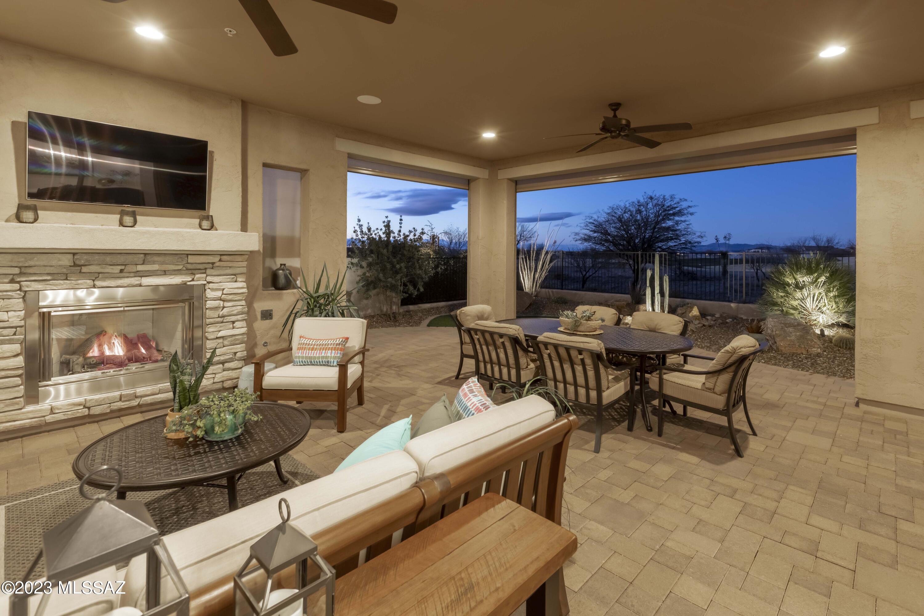 Why wait to build when you can have it all now in this beautiful, highly upgraded Avalon w/golf course view?  Whether relaxing on your covered front porch, or entertaining on the expanded, covered, full solar screen rear patio enjoying your gas fireplace & great view, this home delights!  Yard fully fenced.  Generous cabinets in Great Room & Dining Room, a wet bar/butler's pantry w/mini frig & walk in pantry closet.  Avantium Monogram appliances w/induction cooktop, convection oven, counter depth frig, Blanco undermount sink, Cambria Quartz countertops, under cabinet lighting.  Large den w/built in desk & cabinets, French doors.  Master has large curbless shower & custom organizer walk in closet.  Full three car 4' extended garage w/cabinets, epoxy garage floor & paver driveway.  Hurry!