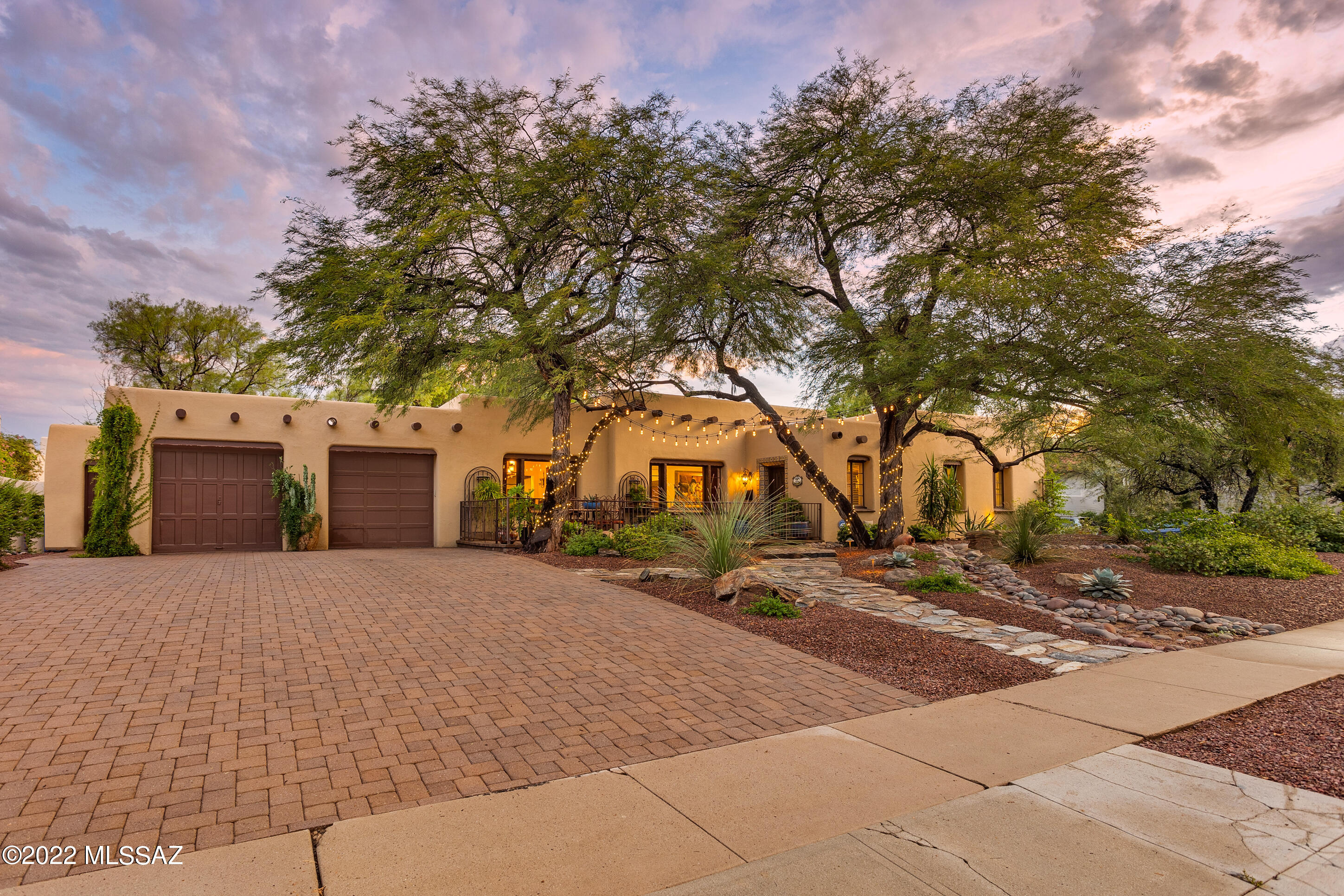 Historic Sam Hughes home 2 blocks from UA campus,1936 classic,lovingly restored w/scored & colored concrete floors, beams, skylights + exquisite garden environment. Entry foyer leads into the formal liv.room w/FP , formal dining room + 30X17 fam. room w/bkst room.Chef's kitchen, granite counters,5 burner gas cooktop w/ custom copper exhaust hood, 2 ovens, 2 dishwashers, Wolf micro, double stainless sinks + large adjoining  wet bar +butler's pantry w/mesquite counters, wine and drink coolers + envious amount of custom wood cabinets. Stately master bdrm w/FP,walk-in closet, sep shower + garden tub.  
This home embodies the quote, ''Don't just buy the home...buy the neighborhood'' Walking/biking  just minutes from a public library, Himmel Park, public pool, tennis courts, restaurants, market