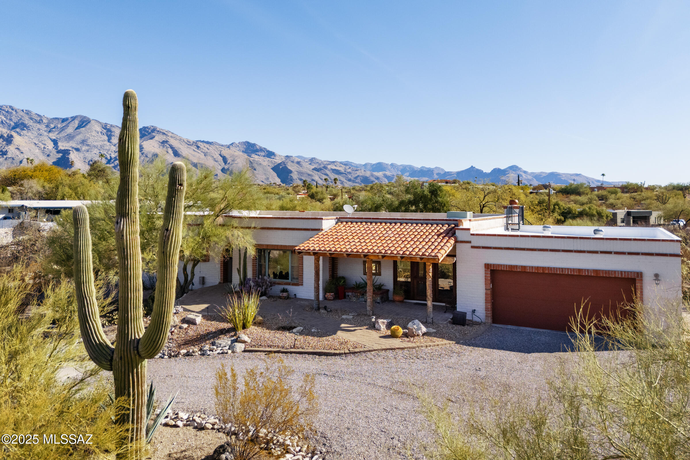 Nestled in the prestigious Flecha Caida Ranch  Estates, this 1.76-acre property offers stunning Catalina Mountain views, modern upgrades, and luxurious living in a peaceful desert setting.
Property Highlights:
 Oversized 2-car garage with a 220V EV charging outlet, Solar panels for energy efficiency, Two air conditioners 1 is newer & two water heaters, New washer and dryer included
Central vacuum system for effortless cleaning.
14' x 7' Endless Plunge Pool with a swim current and locking retractable cover
Outdoor Living at Its Best:
  Walled backyard for privacy
  Expansive patios featuring hand-carved decorative poles
  Celestory window perfectly framing the iconic Finger Rock formation
  Incredible sunrise & sunset views.
 Aggregate concrete driveway for a sleek, modern touch Interior Features:
     " Expertly renovated by renowned Tucson interior designer Mel Lavery
     " Bright & airy layout with floor-to-ceiling windows that flood the home with natural light
     " Freshly painted inside and out
     " Concrete flooring throughout for a contemporary and durable finish
     " GE Monogram & Profile kitchen appliances
     "	Luxurious bathrooms featuring a soaking tub, steam shower, marble tile floors, and Brizo fixtures
Prime Location:
     " Located on a ridge with an east-to-west orientation
     " Catalina Foothills School District & nearby Basis Charter School
     "An extremely quiet, well-insulated home designed for comfort and efficiency
This beautifully updated home is a perfect blend of modern luxury and desert tranquility.