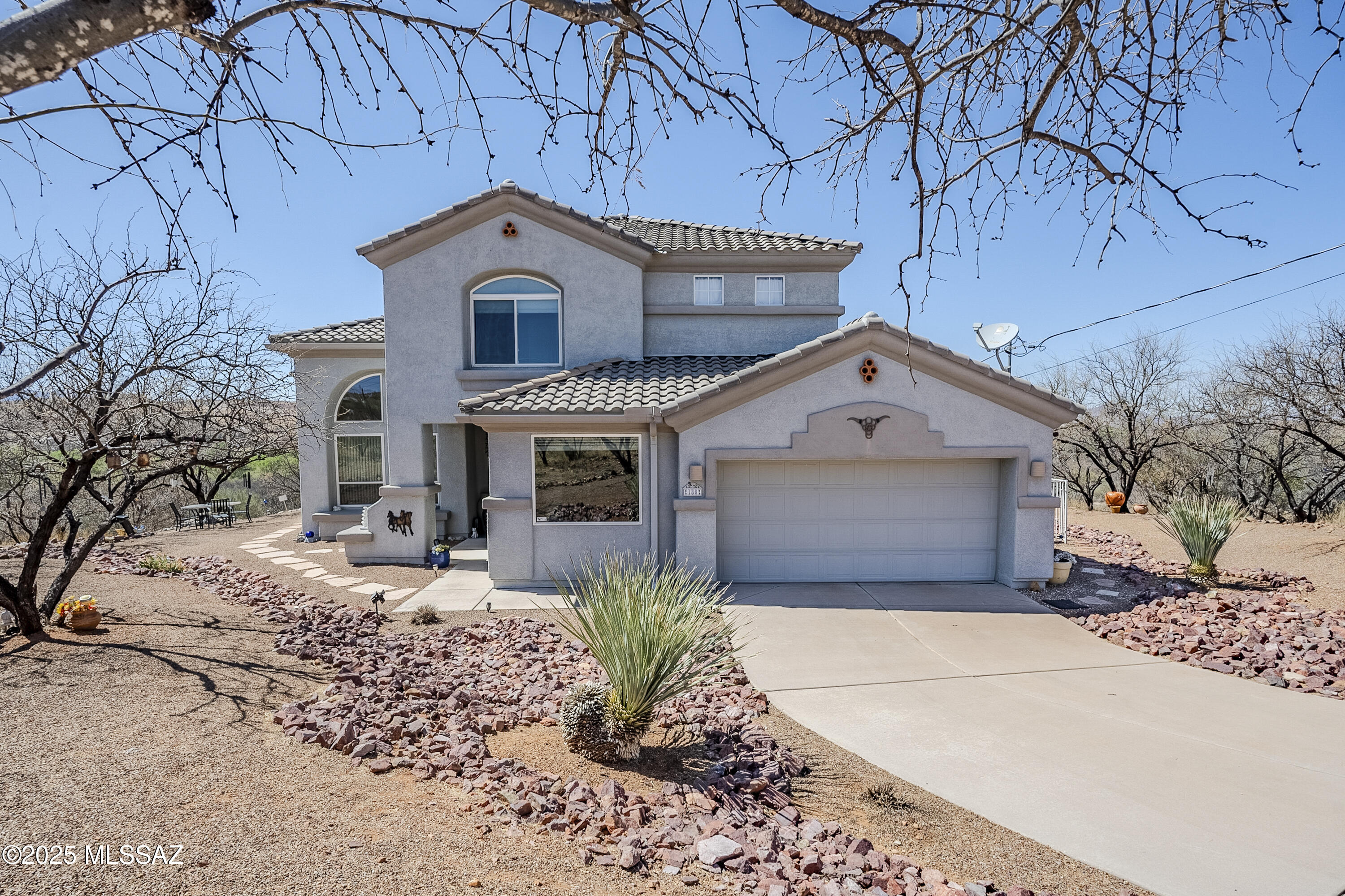 Step into a home where comfort meets adventure! This well-loved, one-owner gem is designed for both relaxation and entertainment. Picture starting your mornings with stunning mountain views and unwinding in the evenings by your solar-heated pool, all within the privacy of elegant wrought iron fencing. Enjoy the added comfort of a refreshing misting system on the back patio and the convenience of automatic shades for effortless relaxation. Inside, enjoy newer 2024 carpet upstairs, a whole-house air purifier, and energy-efficient windows and doors replaced over the years. The newer 2 HVAC units and hot water heater ensures year-round comfort. The multi-level backyard is an entertainer's dream—BBQ, swim, or challenge friends to a game of horseshoes. Don't just picture it—come see it for y