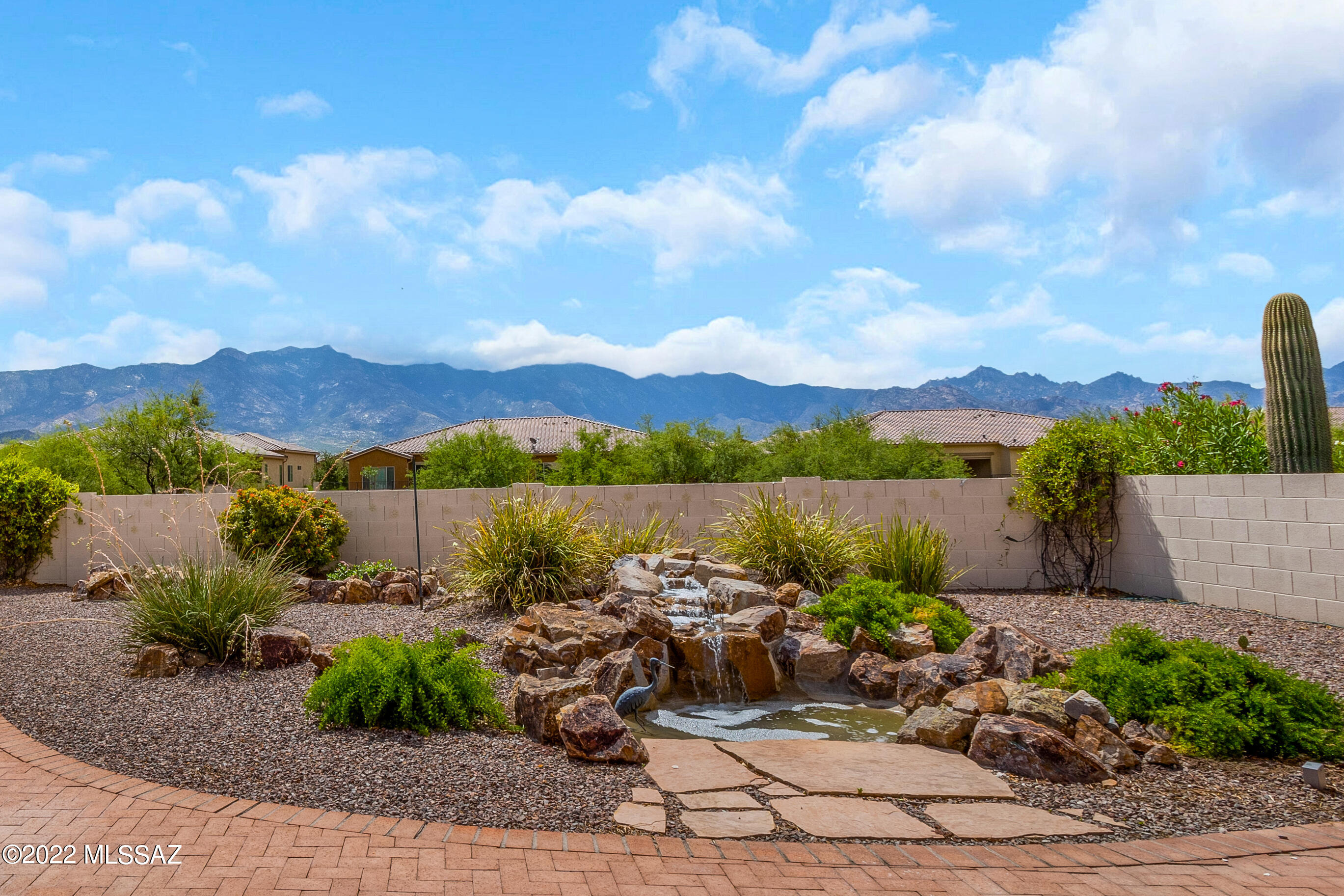 We're Proud to Present a Cimarron with Guest House & Mountain Views. This 3 BR + Den / 3 BA / 2,675 SF / 2 Car Garage Home is a rare find! Open Concept Living! Great Room has Gas Fireplace, wall of windows & mountain views. Kitchen has Granite Countertops, Abundance of Cabinets with pull-outs, large island & kitchen dining area. Double Door entry into Owner's Suite has a slider to patio & mountain views. Updated Owner's Bathroom with walk-in shower & closet. Den/Office. Guest Bedroom with Murphy Bed System & walk-in closet. Updated Guest Bathroom nearby. Guest House has private entrance & bathroom. Laundry Room with W/D & Utility Sink. Extended 2 Car Garage has work bench & cabinets. Lovely Landscaping & Gated Yard. Covered Patio, Water Feature, Built-in BBQ, Fruit Trees & Mountain Views.