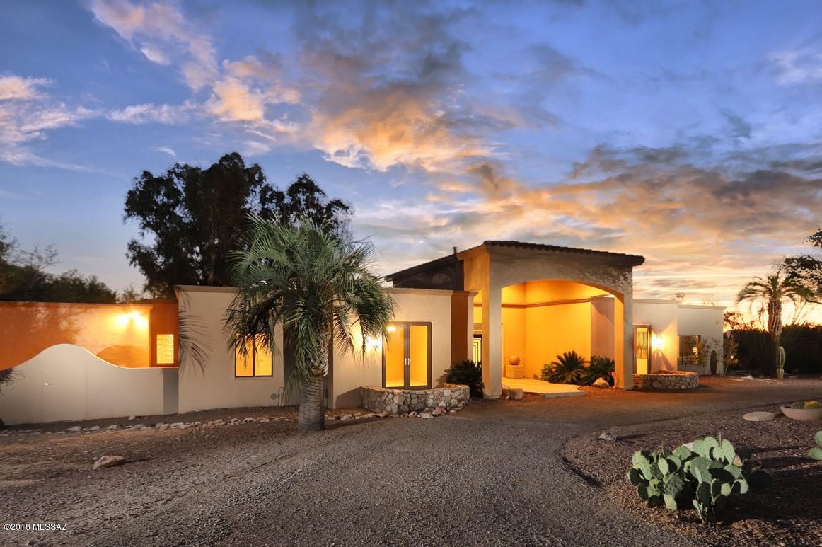 LISTED BELOW SEPT. 2018 APPRAISAL!  You have found your private oasis! Nestled in the foothills of the Catalina Mountains inside the gates of prestigious Skyline Country Club neighborhood, this beautiful home is what you have been looking for! The entire inside and outside of the house and guest house have been freshly painted and new carpet has been installed in the bedrooms and the guest house. Enjoy a chef's kitchen with granite slab counter tops, double ovens, warming drawer & a huge gas stove top will make your party or simple dinner prep a breeze. The kitchen opens to a great room with a gorgeous slate fireplace, exposed beams & large glass doors which open to the tranquil and private backyard. There's plenty of space to relax, play or entertain.    see more... Back inside you'll love the large master suite, with a private deck. Instead of curtains across the glass doors to the deck, you will find the home's vintage original front doors which have been preserved and repurposed, and hung in barn door fashion. The 2nd and 3rd bedrooms are spacious with large closets and the rooms share a Jack & Jill bath. On the other side of the kitchen is a lovely formal dining room, and an attached den/media room. Snuggle up and binge watch your favorite shows on Netflix.
When company comes to visit, you will never run out of room! They will be thrilled to stay in their own guest house just steps away across the lawn of the backyard. There is a large area for a big sleepover for a bunch of kids, or pull the Murphy Bed down for your less nimble guests. The RV garage is attached to the guest house and has its own mini-split system for keeping the area cool if you decide to use it for a craft/hobby area. Don't wait, come see it today!