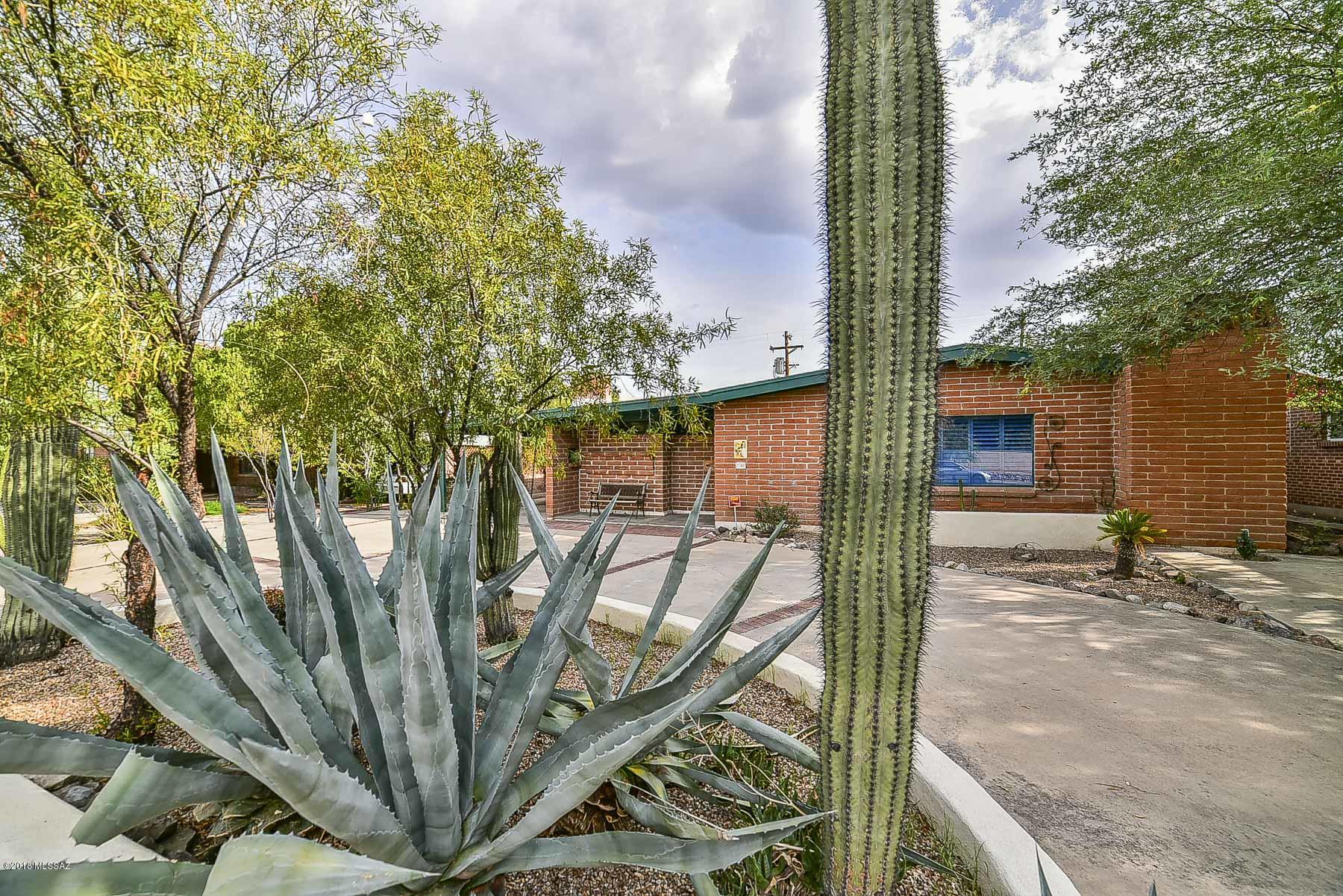 Charming two bedroom, two bath home with a one bedroom casita in the desirable neighborhood of Broadmoor. Spacious living room for entertaining with a separate family room with a cozy fireplace. Both bedrooms provide access to covered back patio. Casita can be used for office space or guest quarters. Enclosed backyard features a sparking pool, easy care vegetation and ramada. Interesting details throughout including wood beam ceilings, French doors, flagstone accents, hand painted Mexican tile and much more! Close to UofA, downtown, dining and shops on Broadway. Walk to Barrio Bread, Cashew Cow, Bisbee Breakfast Club, etc. A terrific find in a popular midtown neighborhood. Come see today! Don't miss this opportunity.
