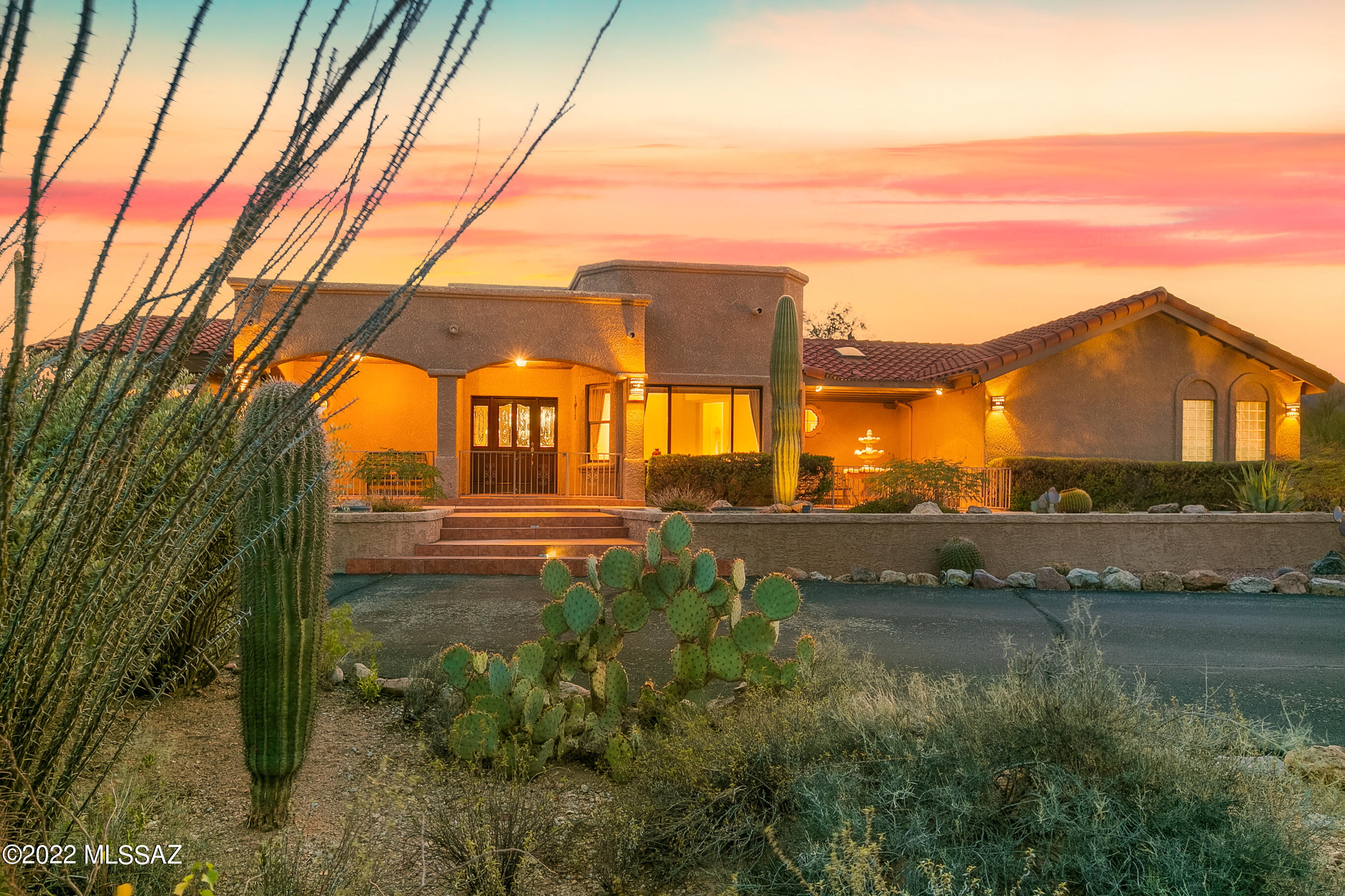 MAGAZINE WORTHY MOUNTAIN, SUNSET & SUNRISE VIEWS!! PRIVACY GALORE IN A LUSCIOUS BACKYARD DESERT OASIS WITH A SPARKLING POOL! Situated on just under 3 acres, this 2929 sq ft custom home (3BR/2.5BA/Office-Den) sits at the base of the Tucson Mountains & right across from Feliz Paseos Trails Park (see ''documents'' tab) & minutes from Downtown, Gates Pass & Saguaro National Park. Indoors, you will find a beautiful floorplan w/ picturesque views through every window. Large bedrooms, plus an extra den/office & even a bonus room off the Primary Bedroom gives everyone space & privacy. All of your guests will love hanging out in the heart of the home-the Huge Kitchen complete with a built in buffet, wet bar, island & breakfast bar! All of this PLUS the backyard of your dreams! Visit & Fall in Love!