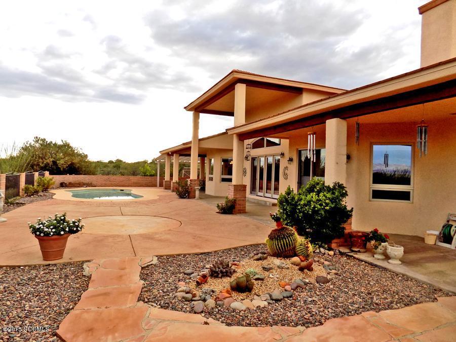Magnificent Custom Hm w/Incredible Views! This solar 4bd/den/3.5ba home w/pool & 4 car gar is a rare find. Unique features incl 3-zoned radiant heat, soaring 18' ceiling @ grt rm, 2 FP, lock out gst. Ste (Bd, Ba + sitting area off patio) exp east patio doors/wind capturing the panoramic views..In addition-Mueller steel ins gar/wrkshp for RV/car stor or restoration. (Will hold min 20 cars) RV HU, 10' and 12' doors, 1/2 ba, airlines exhaust fans, 200 amp serv. Addt'l 16'x24' gar & 17x54 Carport..