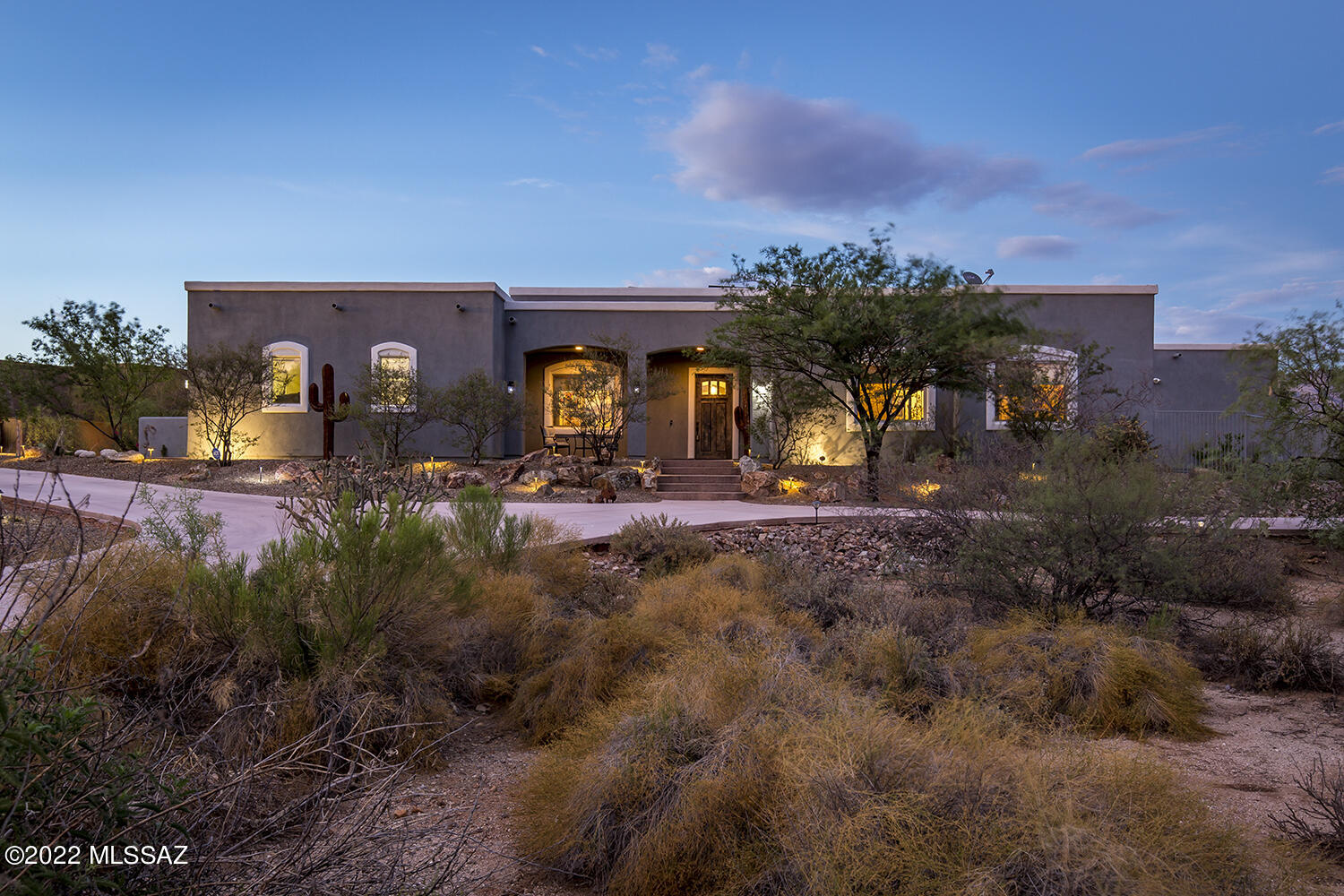 Luxury, lifestyle and location await you at the Casa Adobes newer-build custom home.  Situated on .8 acre with majestic views of the Catalina mountains, sunrise and sunset, the main home features a split-plan 3BD/3BA floorplan with an office/den, spacious living areas and a large gourmet kitchen.  The guest house invites your guests or independent teenager with separate entrances, a full eat-in kitchen, living area, laundry closet, and a full bath w/walk-in closet.  Outdoor entertaining in this backyard oasis, the ''spool'' is pebble-tec, self-cleaning, and heated.  Solar PV, water purifier, R/O, and a Tesla charging station round out the numerous amenities.  Bring your RV and toys to this non-HOA, close to everything luxury home.