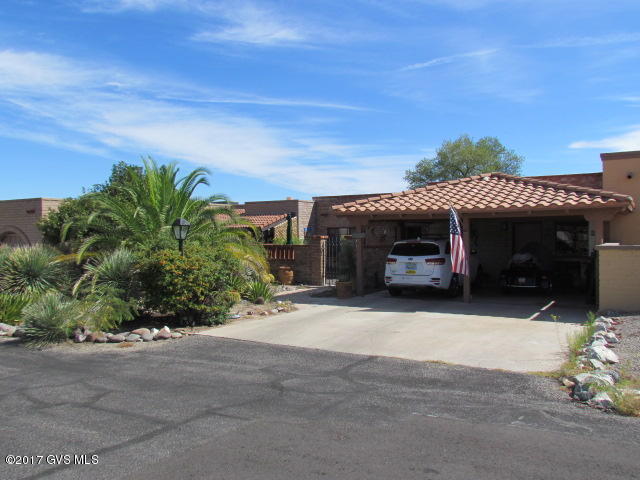 Nicely updated townhome in Townhome 4 with mountain view-back, front and back courtyards with water fountain in front on quiet Cul-de-sac/Mostly Sal-teal floor tile with Berber carpet in both bedrooms/No home behind-desert/HVAC rpld 2011/Stove rpld 2014/Frig rpld 2015/Interior painted 2016/Microwave new/Hall bath new vanity, sink-faucet, toilet, and shower head/Master bath new shower head/New lighting LR-DR/New element-fireplace/Garden window-kitchen/Water filter system/5 skylights/2 bifold closets-master/Private backyard with drip system/Work bench and storage cabinets in carport