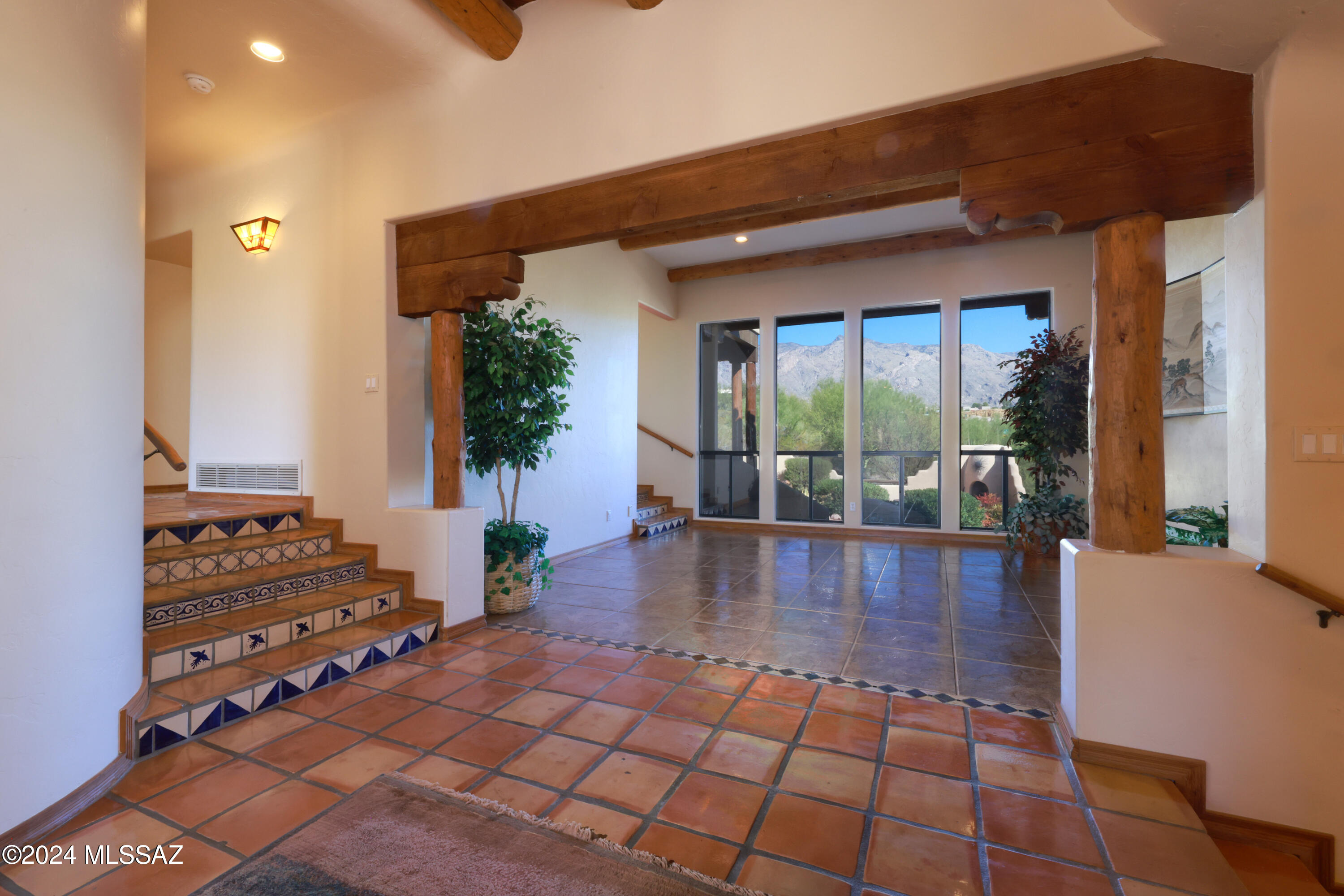 Stunning La Paloma Estates, John W. Kline designed and built Sante Fe home. This charming multi-level 4 bedroom 3 bath 3 car garage home will capture you with the stunning Santa Catalina mountain views. This is the home you've been waiting for. Perfect for you and your growing family.  Featuring Sante Fe  touches including: talavera and saltillo tile; peeled poles and corbels; 4 fireplaces  (gas and wood burning) located in the family room, master bedroom, front courtyard, backyard ramada; and so much more. Ideal Floorplan with separate living and family room , formal dining and breakfast room. Don't miss this one..  Located in the exclusive La Paloma Estates.