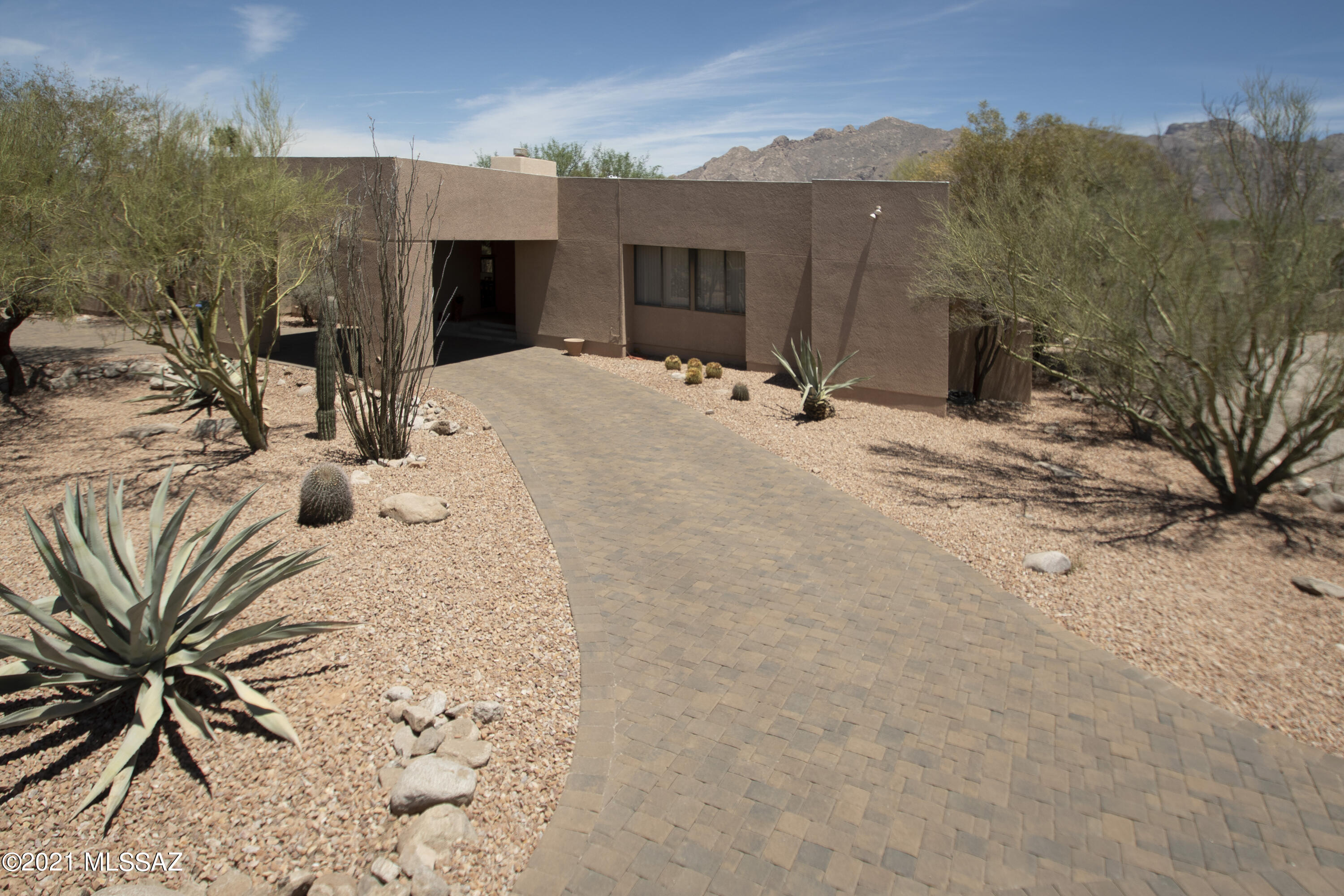 Located in much sought after Shadow Hills, this contemporary split floorplan 3,383 SqFt 4 bed/4ba won't last long! It has 2 master suites, living room, family rec room, dining area and eat-in kitchen with breathtaking Catalina mountain views. Granite kitchen boasts huge breakfast bar overlooking the large backyard & magnificent mountain views. High ceilings, lots of natural light, tons of storage, and a spacious backyard with covered patio make this a wonderful family home! One of the few Shadow Hills lots without a pool but plenty of room to add one. The large family rec/office is great for entertaining. Front entrance with shaded portico. Newly painted exterior (May 2021), all new LED lighting and a beautiful paver driveway are some of the updates.