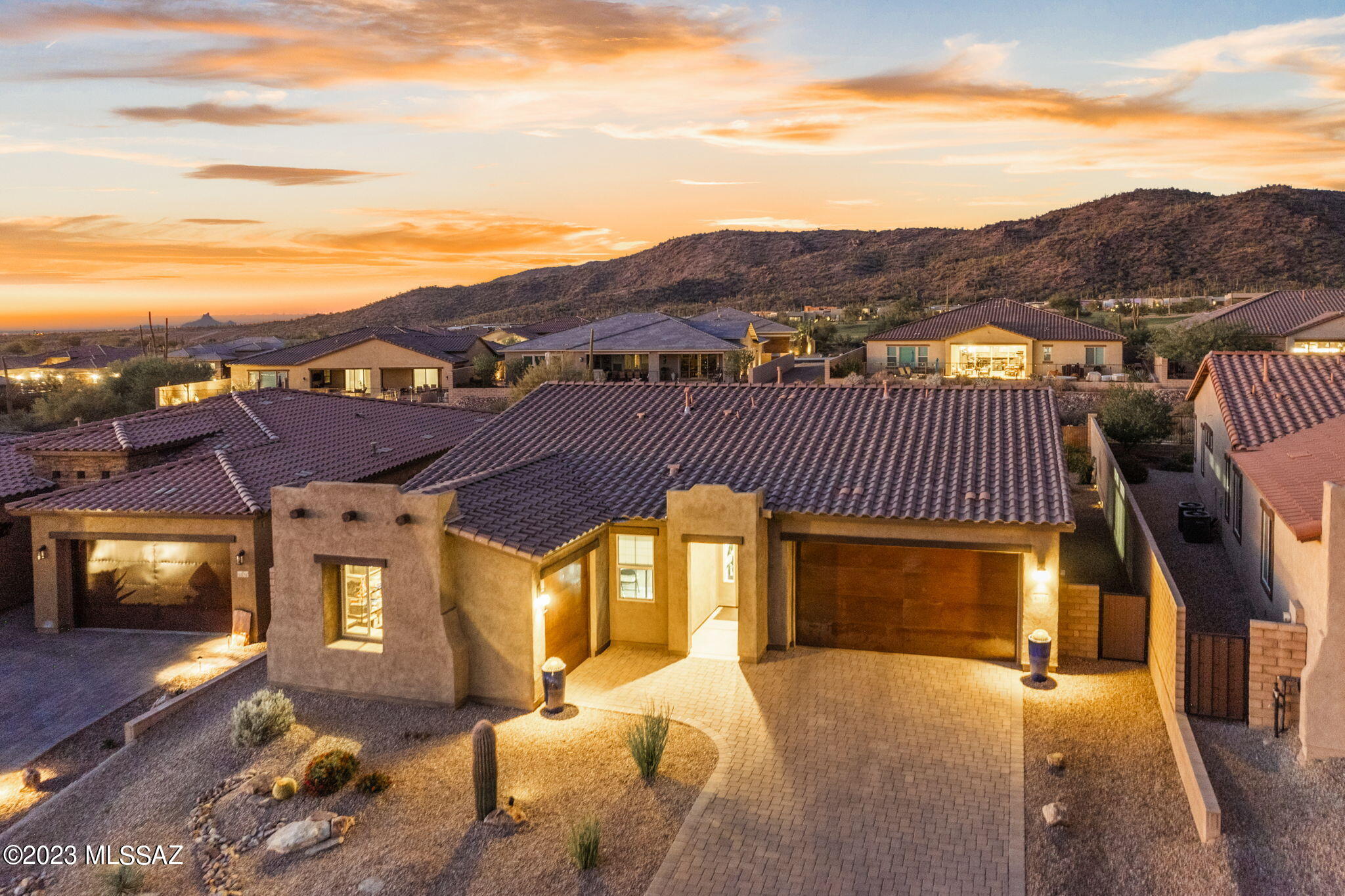 This gem is nestled in the heart of Dove Mountain with access to award winning golf and hiking trails. Just beyond the gates of Ritz Carlton this immaculate home shows like a model with amazing details. Featuring an open concept this 3-bed, 2-bath plus a den/office is perfect for those who appreciate pride of ownership. The interior is a testament to clean design and thoughtful craftsmanship, offering an exceptional blend of comfort and style. The professionally landscaped backyard is a haven for outdoor lovers, complete with a stunning pool, turf and full paver patio. It is the perfect spot for relaxation or entertaining guests. The 3-car garage has beautiful epoxy floors. Enjoy the mountain views on those tranquil evenings with no neighbors directly behind you.
