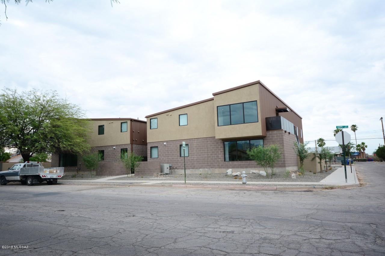 Rare opportunity to purchase newer construction within 3 blocks of UofA around a 8.8% Cap rate! This newer building integrates metal roofing with block and stucco finishes for a really neat modern look that the students love. 4-plex, with 8bds/3.5bths per unit. Large units with huge common areas, all tile throughout, hardwood cabinets, corian counters, and ample appliances. Floorplan designed by and for students. Pool, Large Parking lot, basketball hoops, and fully enclosed yard and common area.Fully leased through July 2018. Full package available.